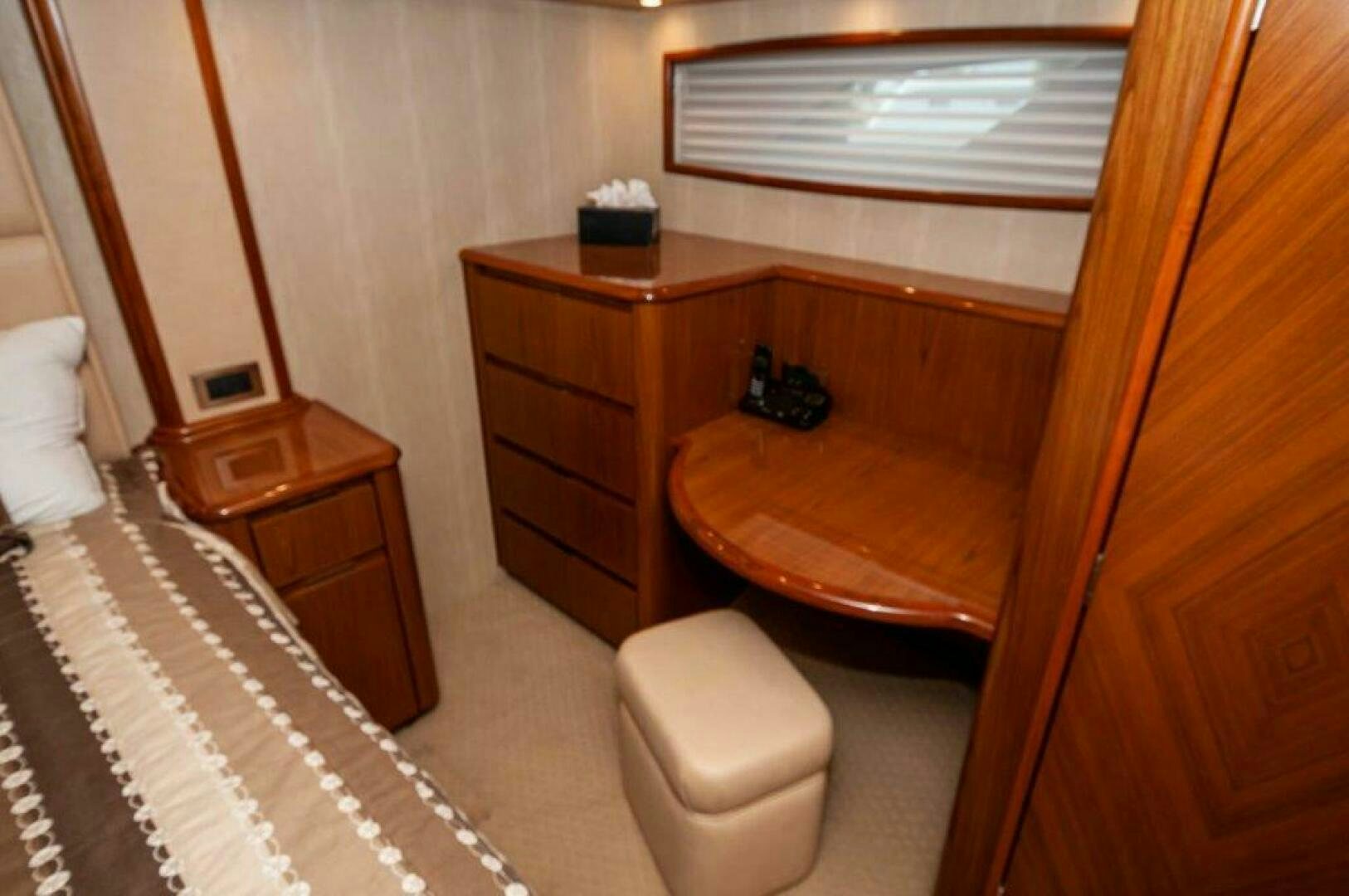 a wood dresser next to a mirror aboard BAREFOOT DRIVE Yacht for Sale