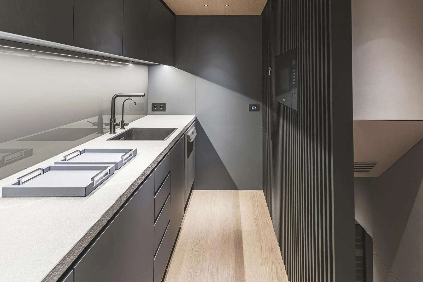 a kitchen with a sink and a refrigerator aboard CONRAD C144S HULL 4 Yacht for Sale
