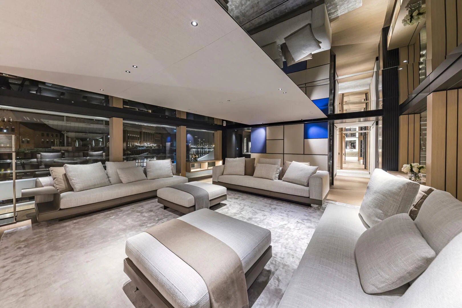 a living room with a couch and a table aboard CONRAD C144S HULL 4 Yacht for Sale