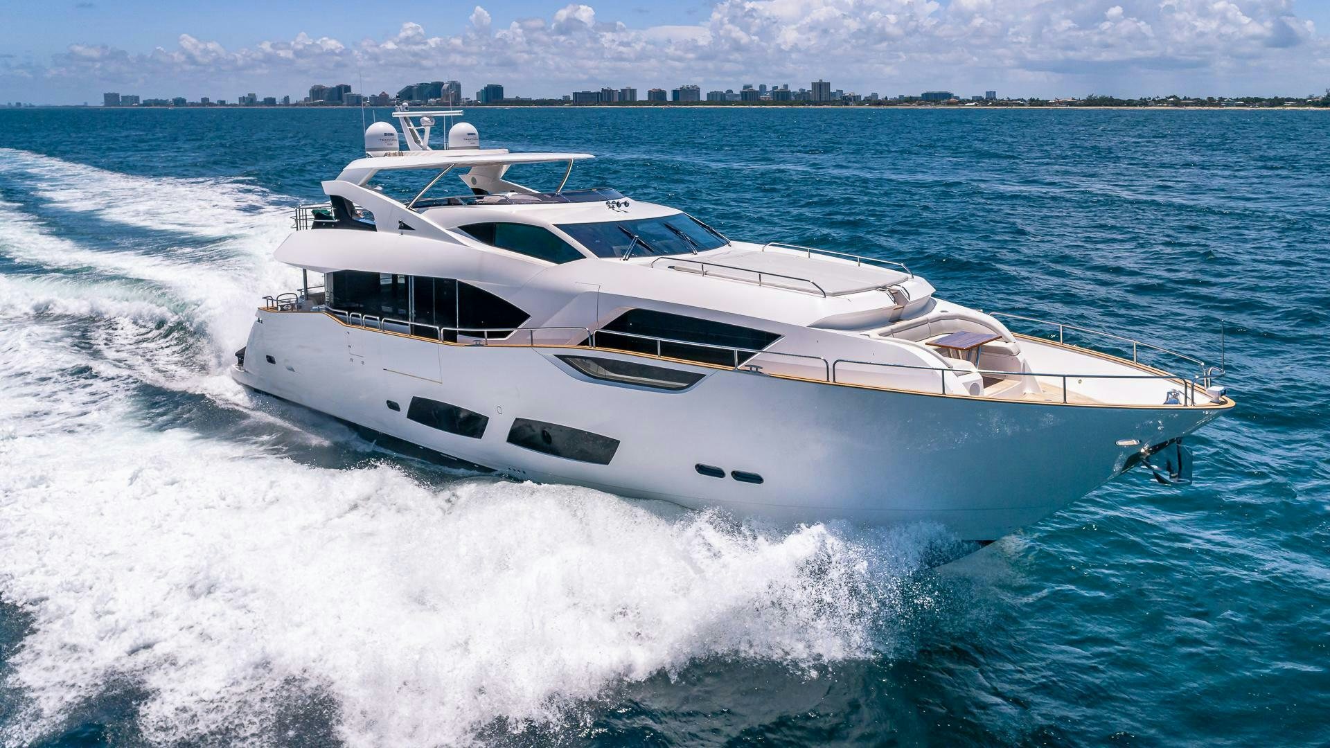 a white yacht on the water aboard MIRRACLE Yacht for Sale
