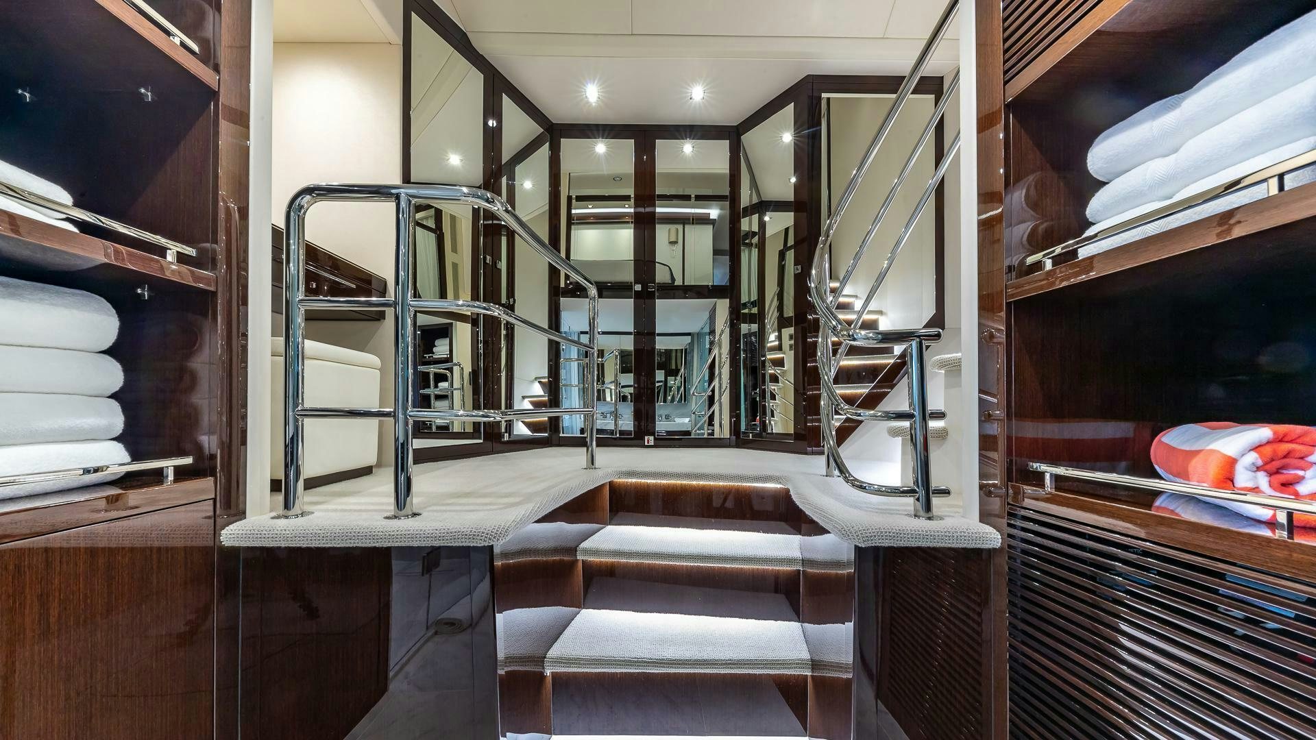 a room with a staircase and a ladder aboard MIRRACLE Yacht for Sale
