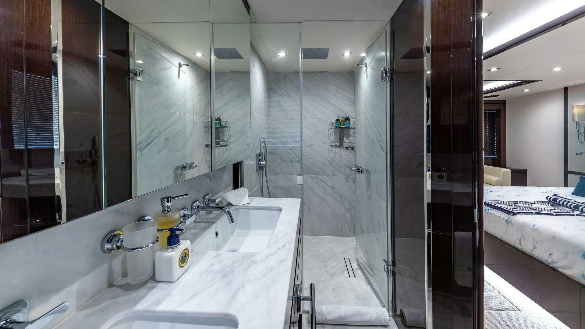 a bathroom with a large glass shower aboard MIRRACLE Yacht for Sale