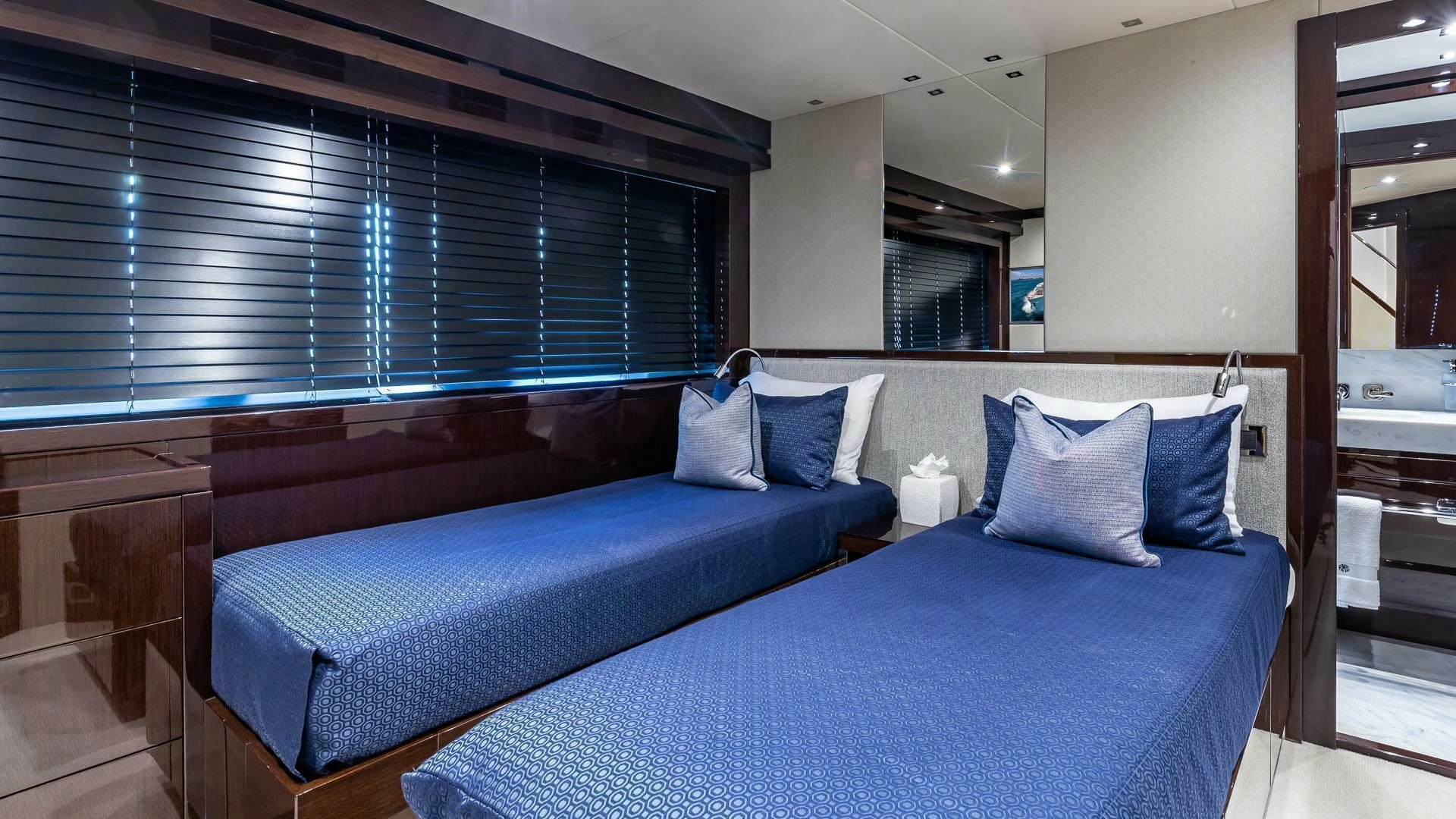 a bed in a room aboard MIRRACLE Yacht for Sale