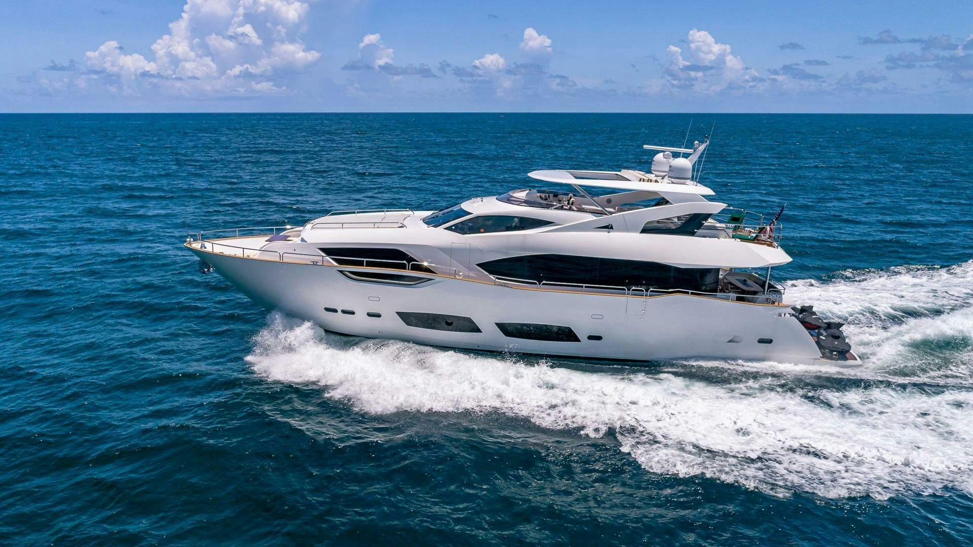 a white yacht on the water aboard MIRRACLE Yacht for Sale