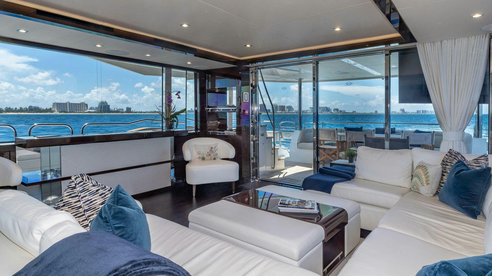 a room with a view of the ocean and the ocean aboard MIRRACLE Yacht for Sale