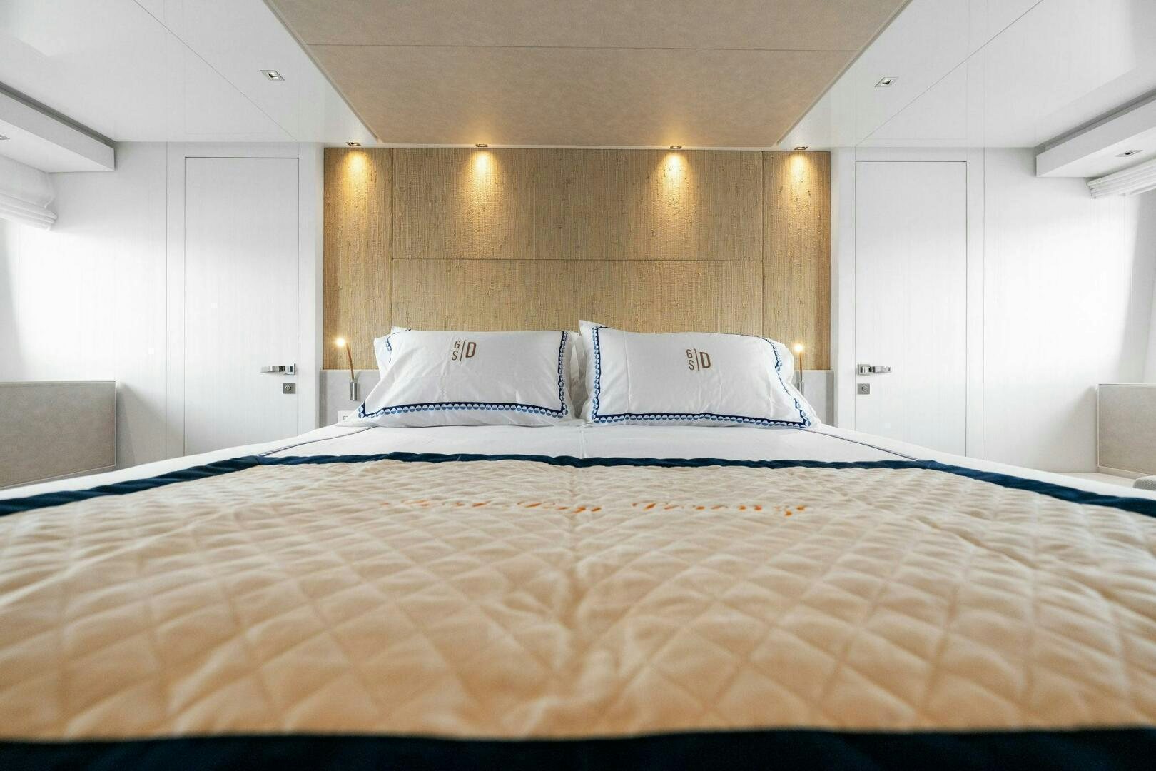 a large bed with white pillows aboard SORI SAN LORENZO Yacht for Sale