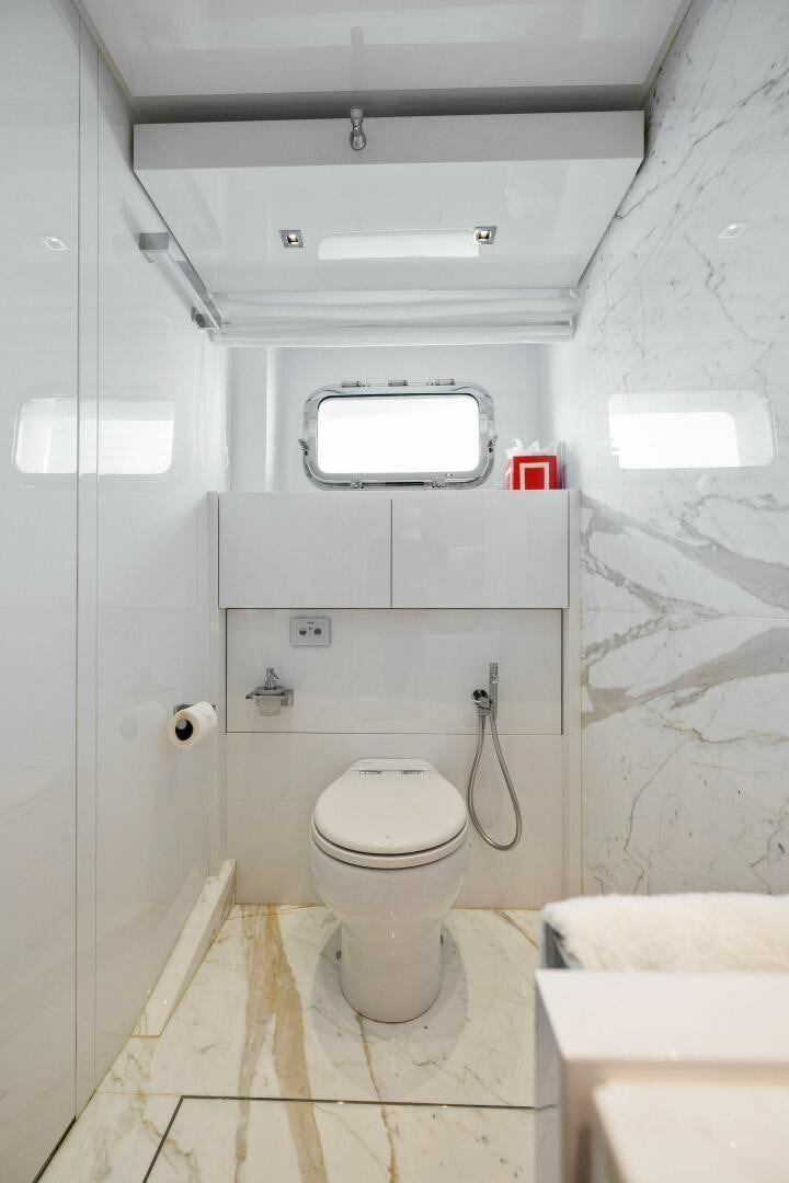 a small bathroom with a toilet aboard SORI SAN LORENZO Yacht for Sale