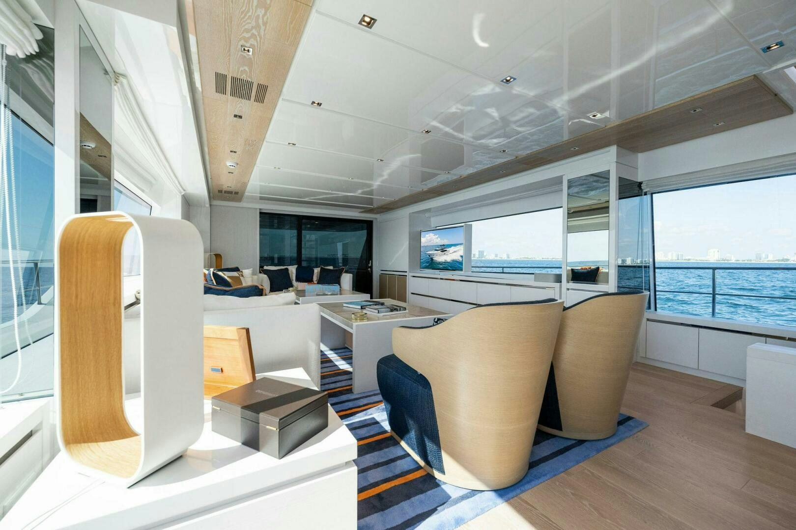 a room with a couch and a table aboard SORI SAN LORENZO Yacht for Sale