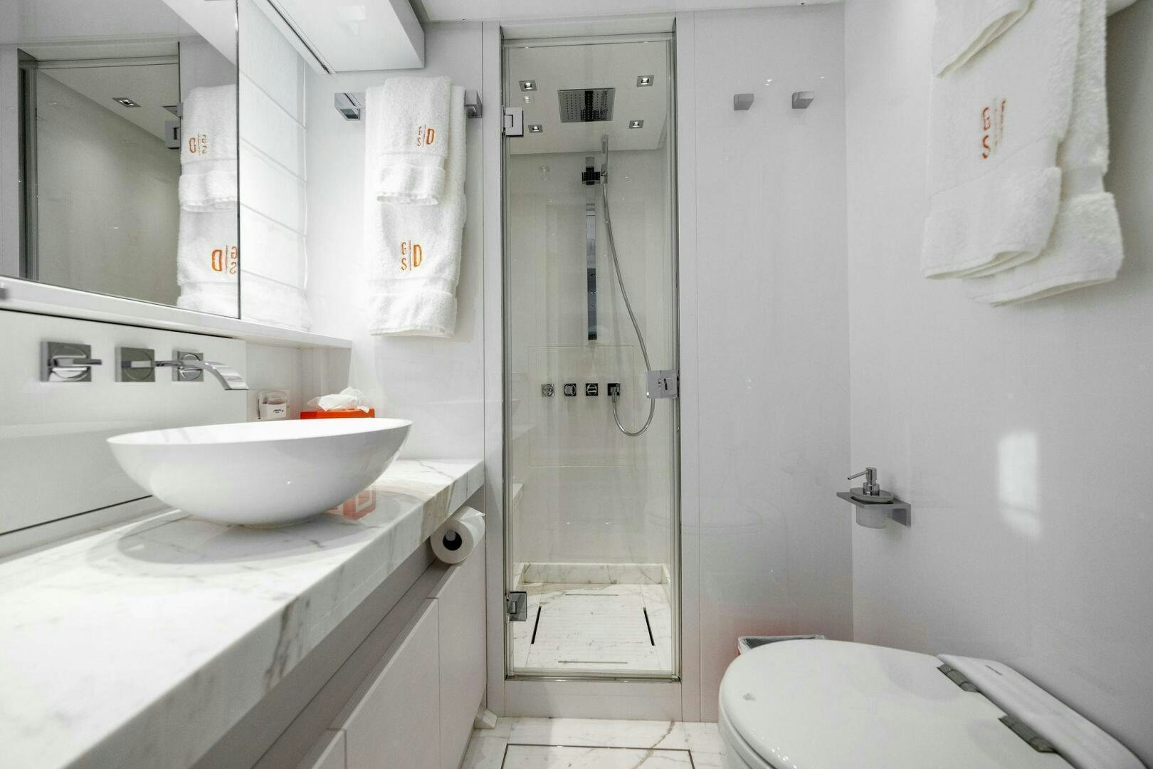 a bathroom with a shower sink and a toilet aboard SORI SAN LORENZO Yacht for Sale