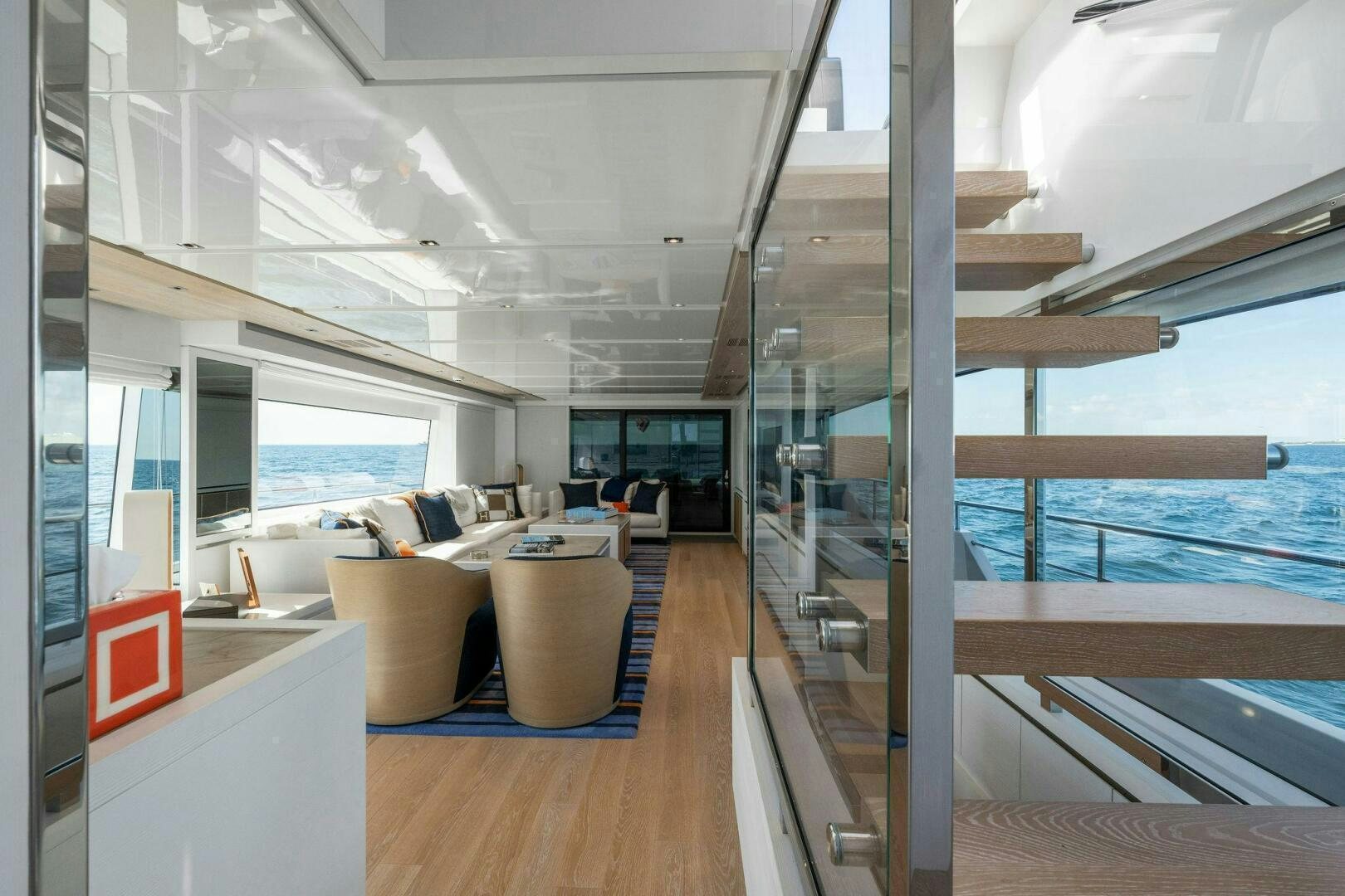 a room with a view of the ocean and the deck aboard SORI SAN LORENZO Yacht for Sale