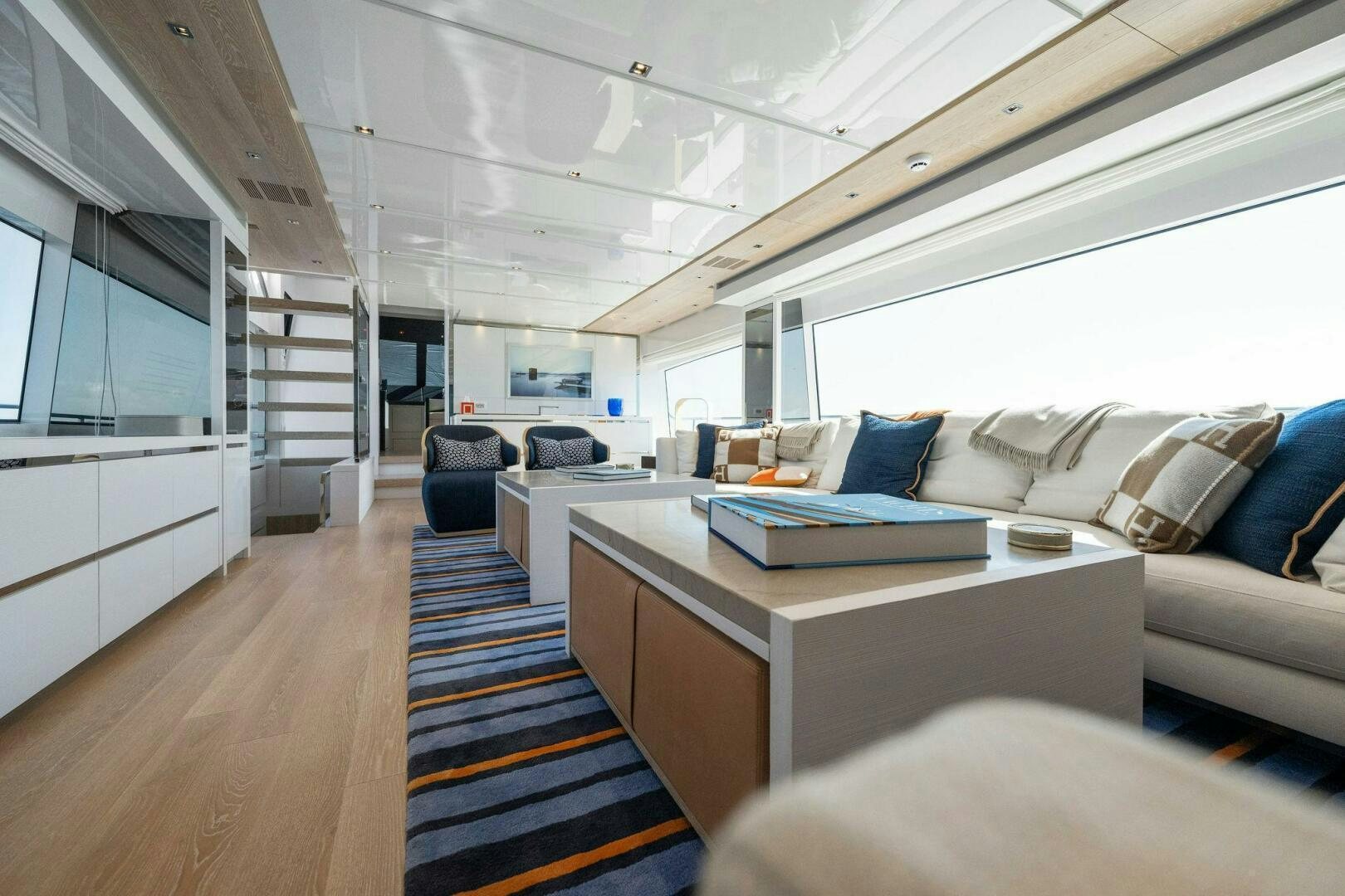 a room with a couch and a desk aboard SORI SAN LORENZO Yacht for Sale