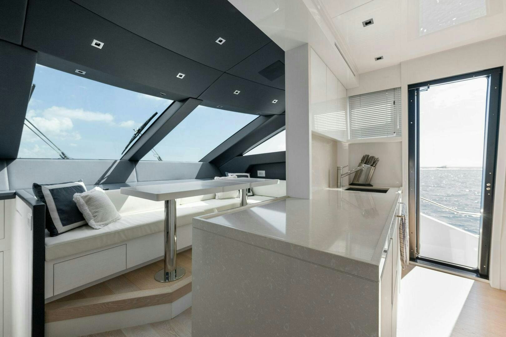 a room with a bed and a table aboard SORI SAN LORENZO Yacht for Sale