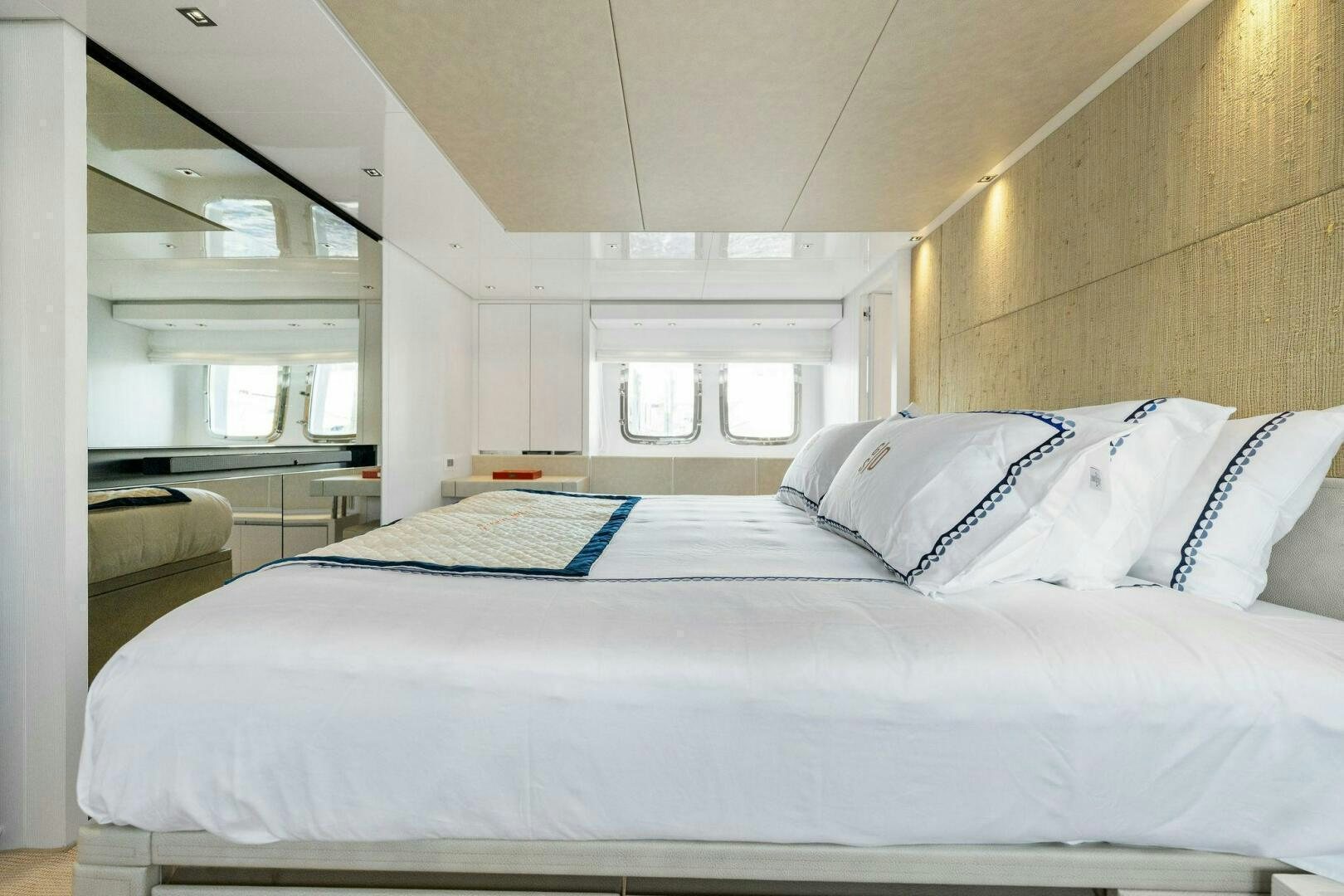 a bed with white sheets aboard SORI SAN LORENZO Yacht for Sale