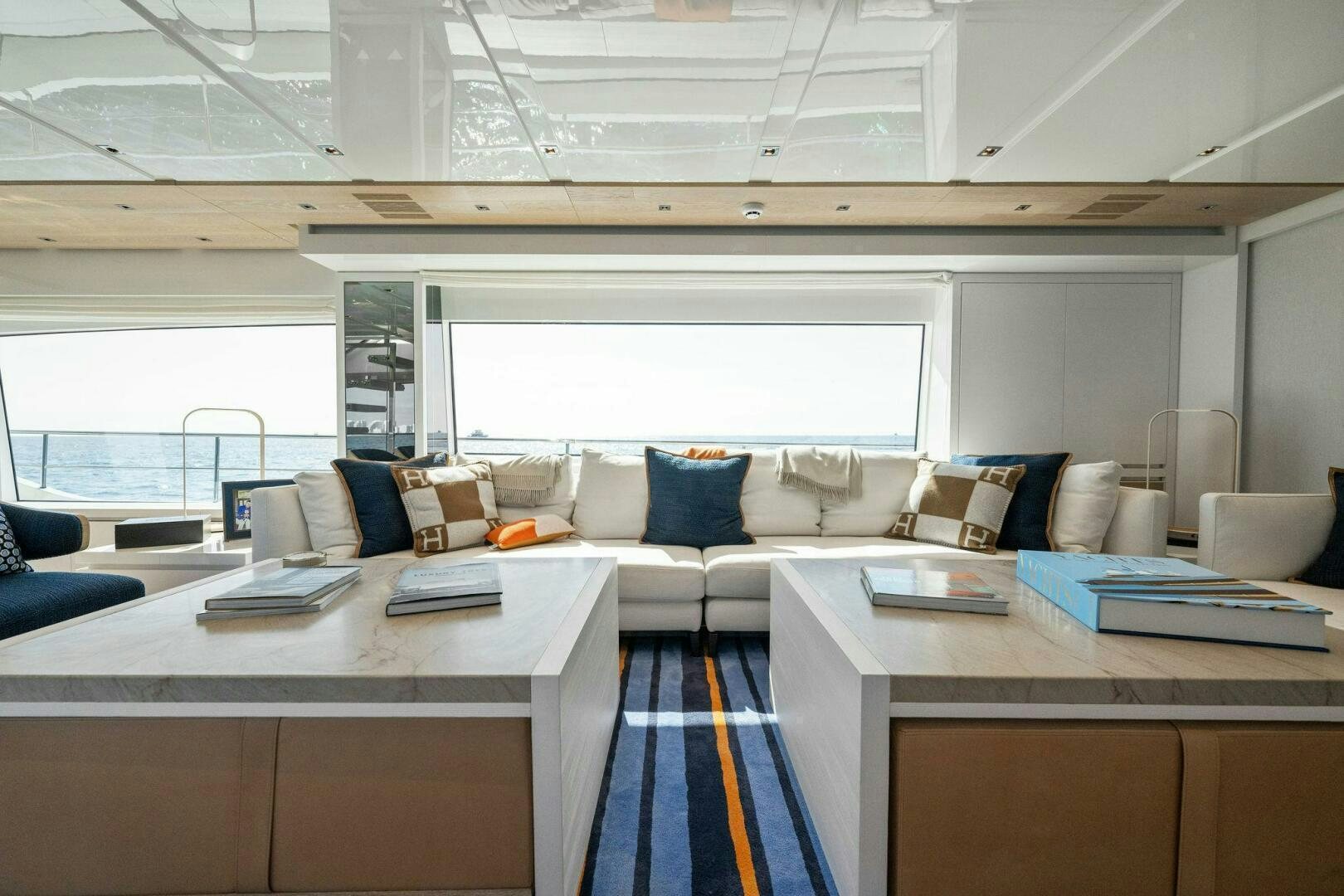 a room with a couch and a table aboard SORI SAN LORENZO Yacht for Sale