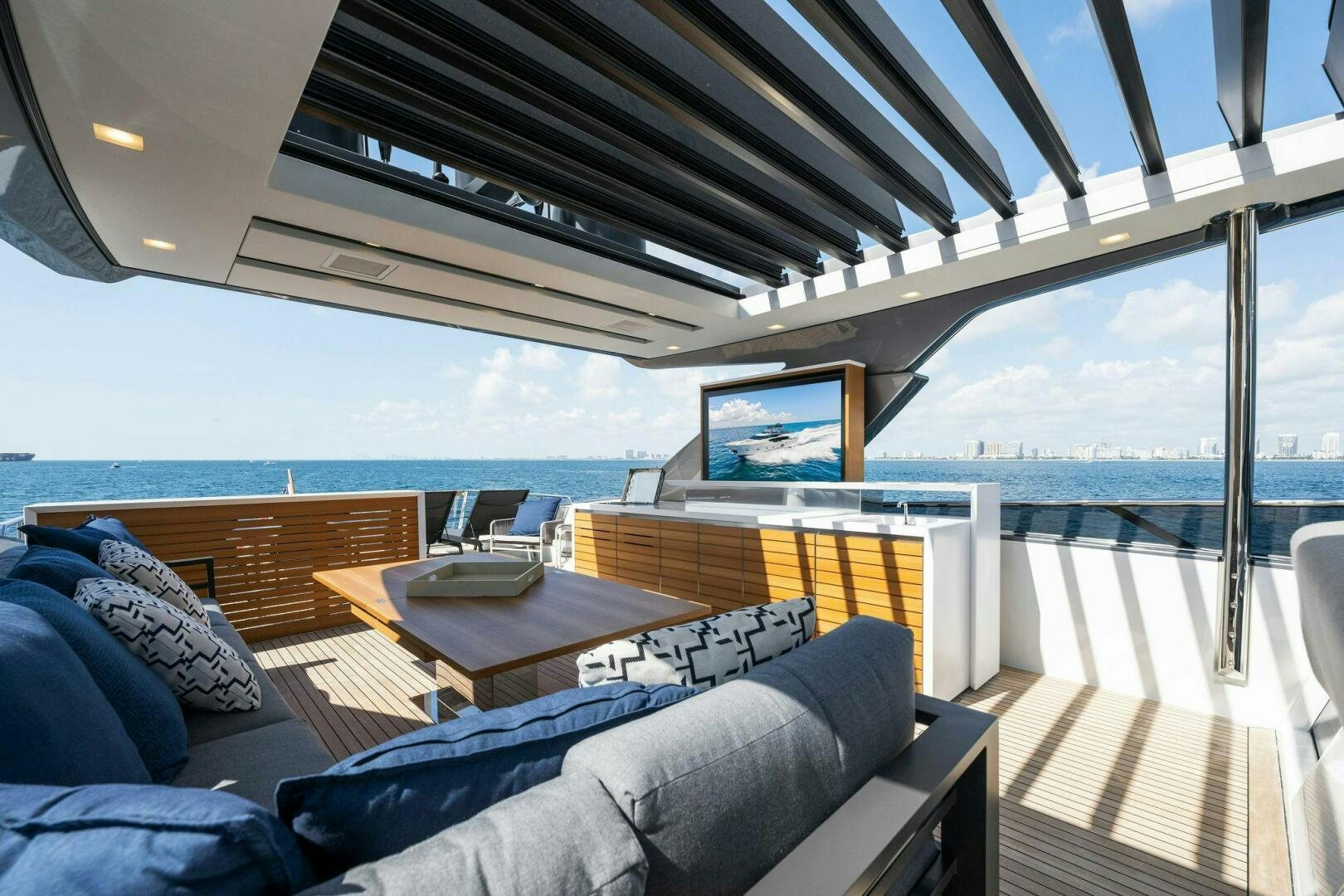 a living room with a large balcony aboard SORI SAN LORENZO Yacht for Sale