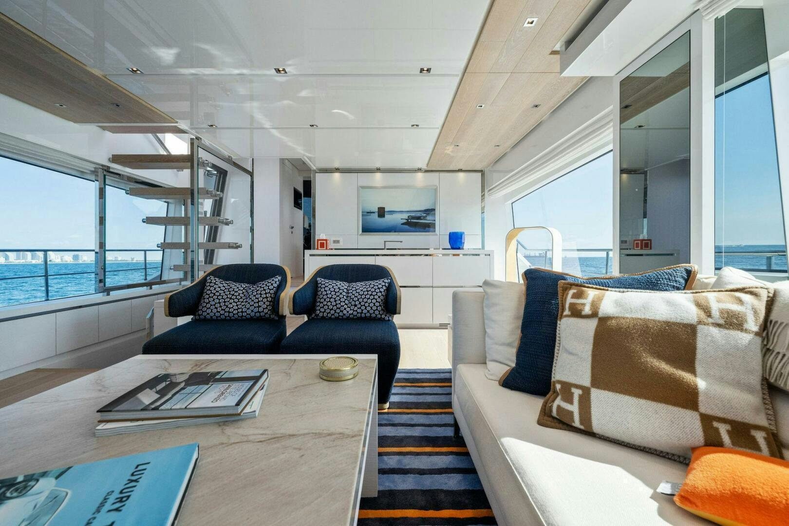 a living room with a large window aboard SORI SAN LORENZO Yacht for Sale