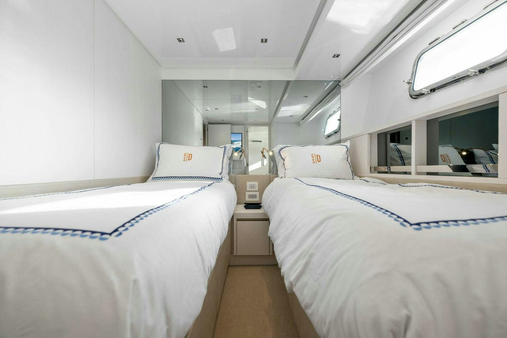 a room with beds and a laptop aboard SORI SAN LORENZO Yacht for Sale