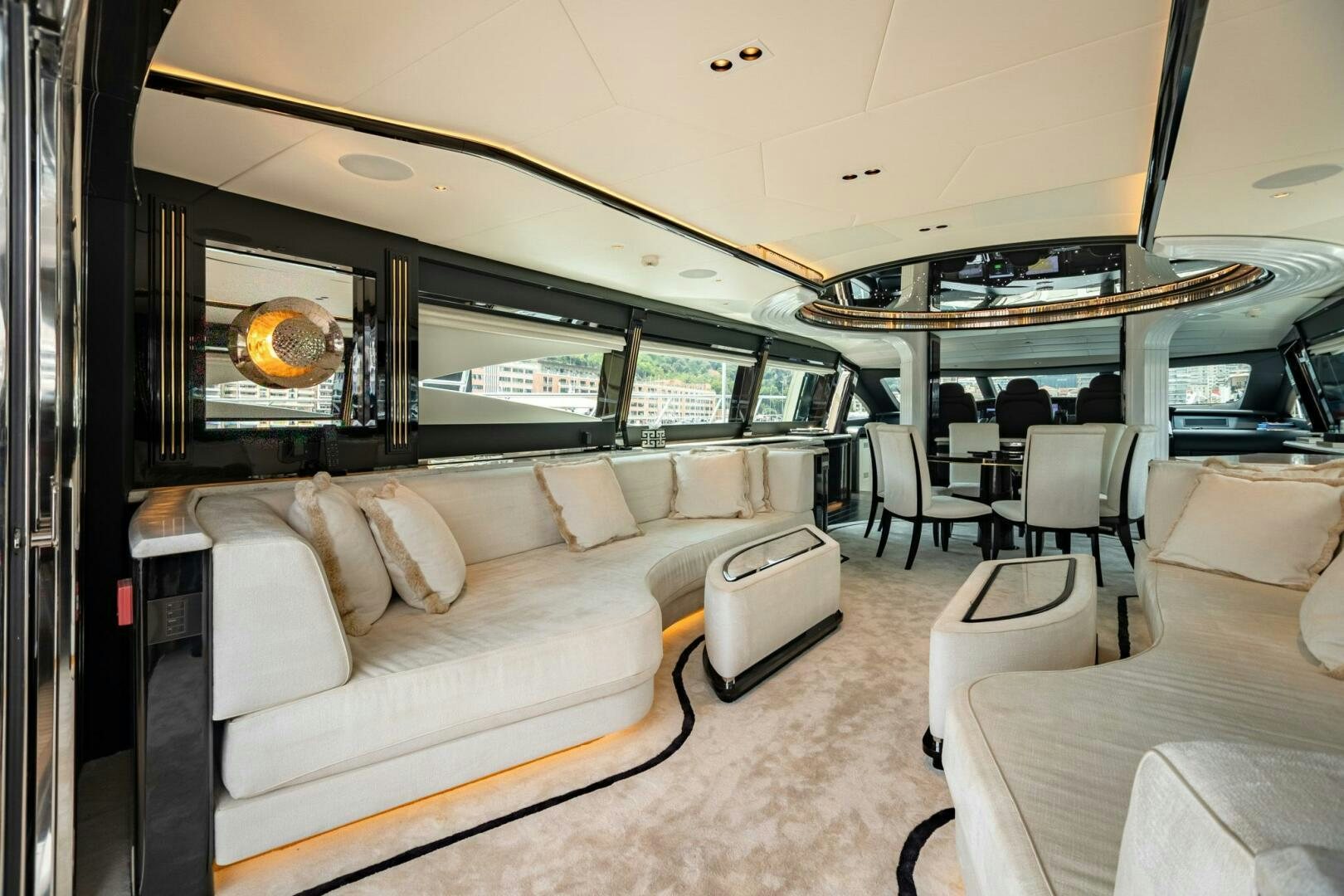 a living room with a couch and a television aboard 1K Yacht for Sale