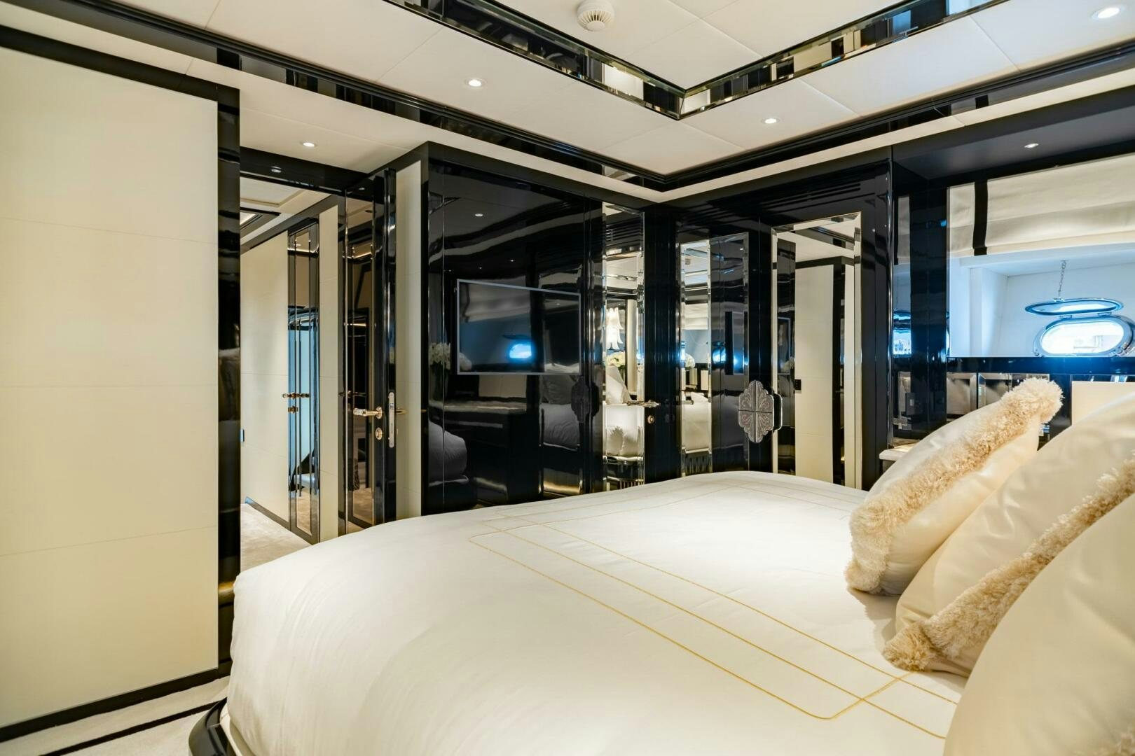 a room with a bed and a tv aboard 1K Yacht for Sale