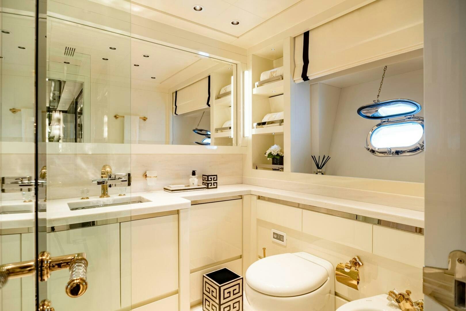 a bathroom with a large mirror aboard 1K Yacht for Sale