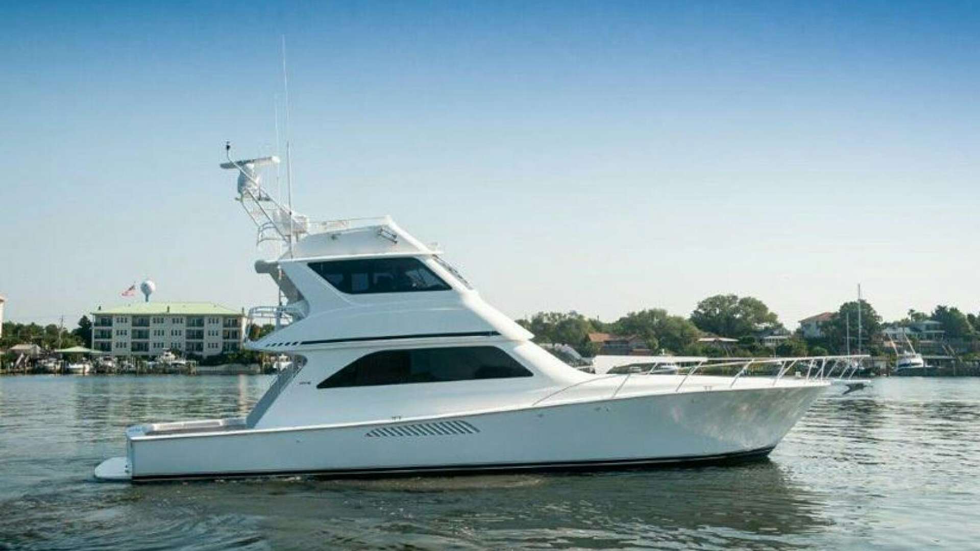 a white yacht in the water aboard KIKI Yacht for Sale