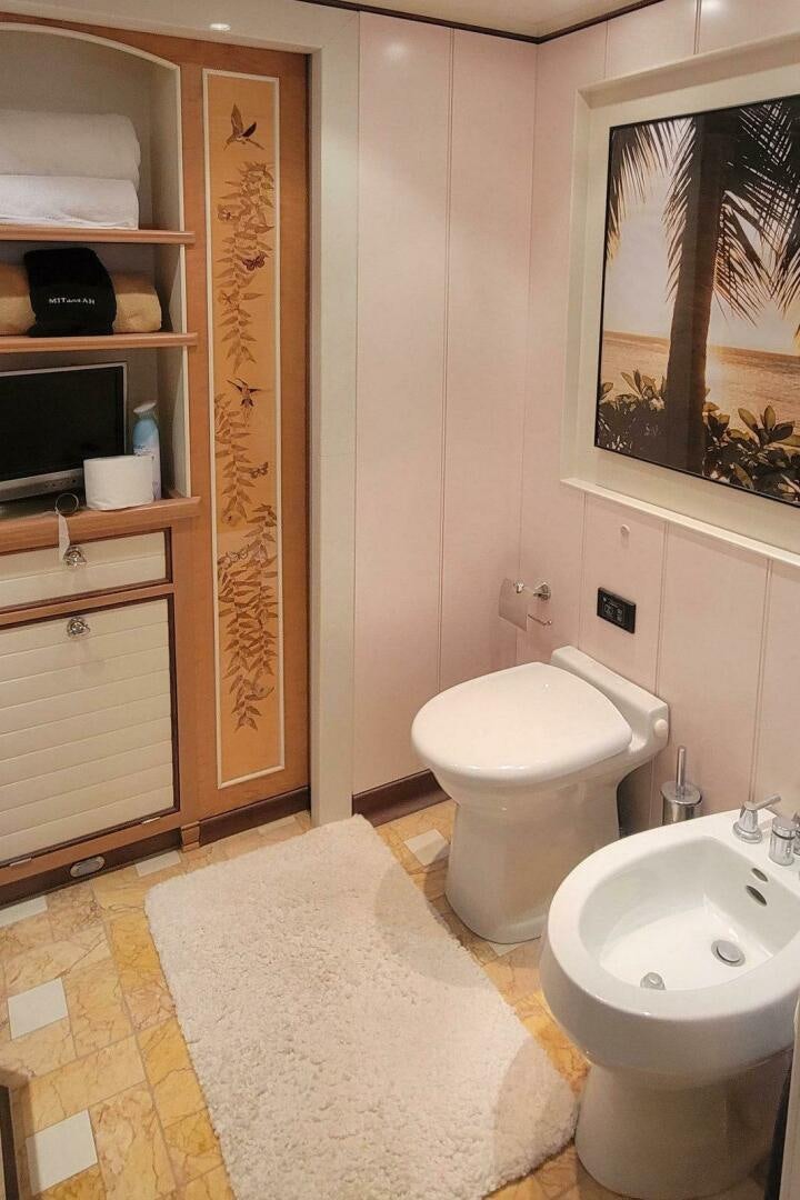 a bathroom with a toilet and sink aboard MITSEAAH Yacht for Sale
