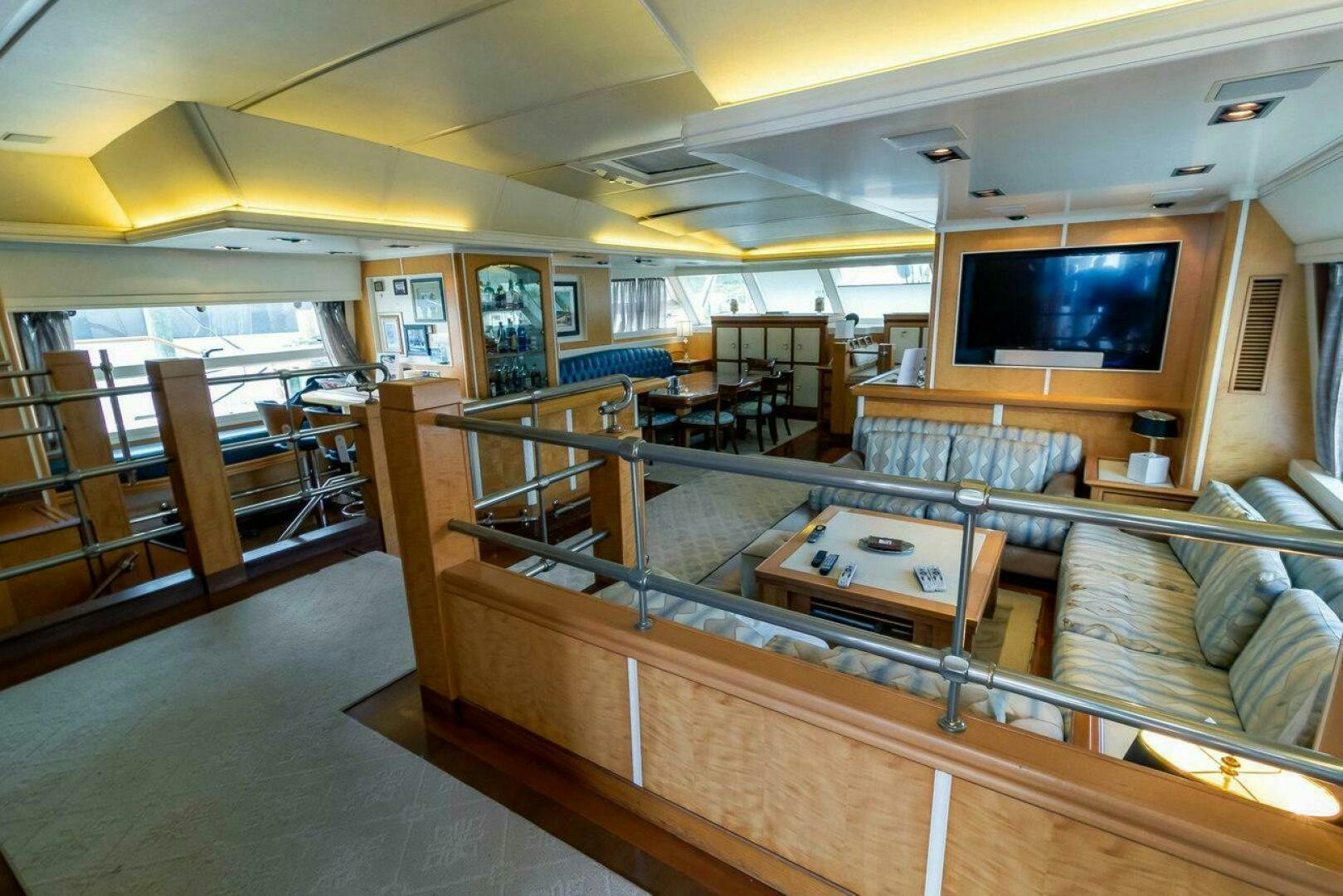 a room with a tv and couches aboard MITSEAAH Yacht for Sale
