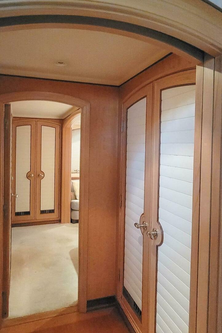 a room with a door and a mirror aboard MITSEAAH Yacht for Sale