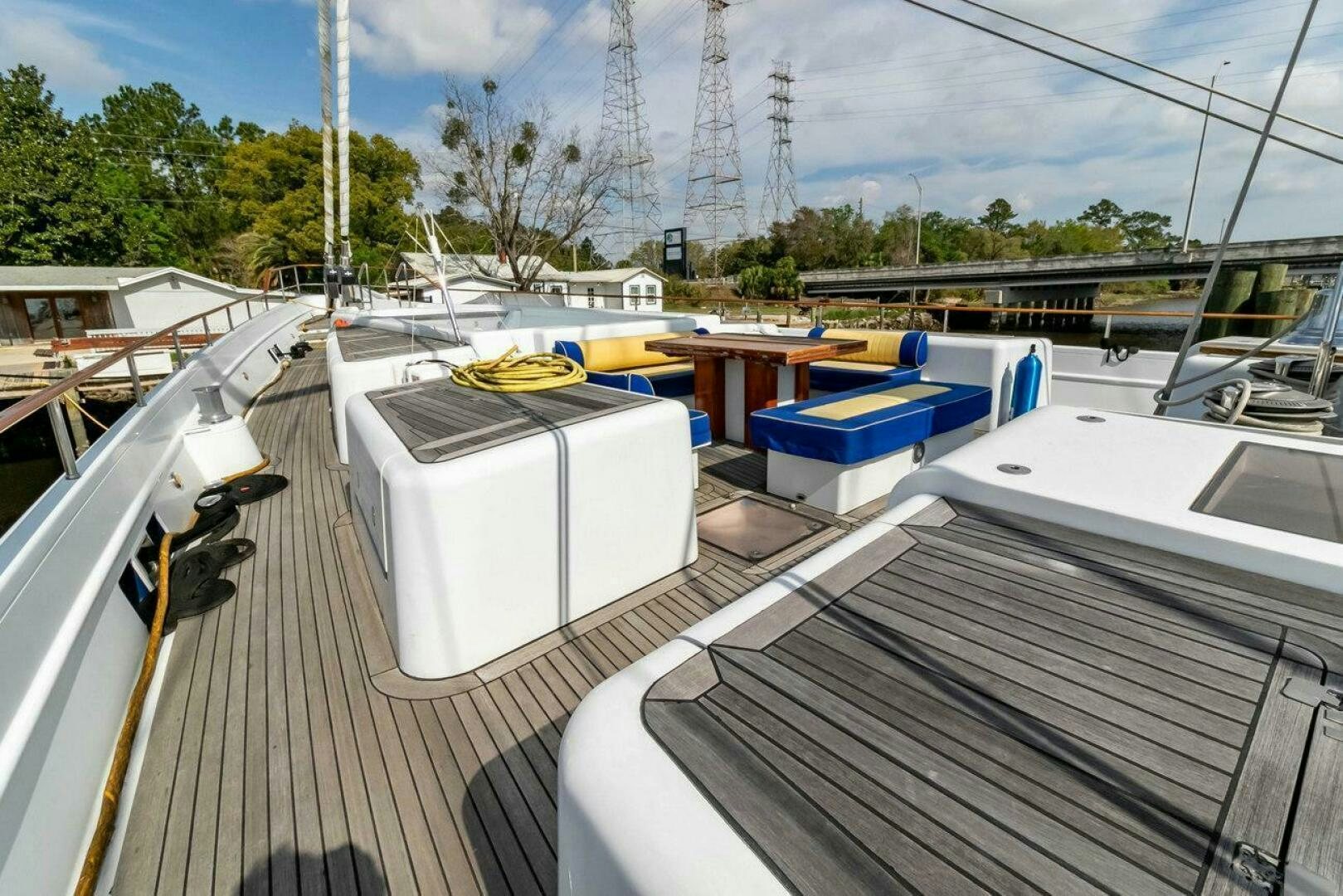 a deck with a deck and a view of a river and a bridge aboard MITSEAAH Yacht for Sale