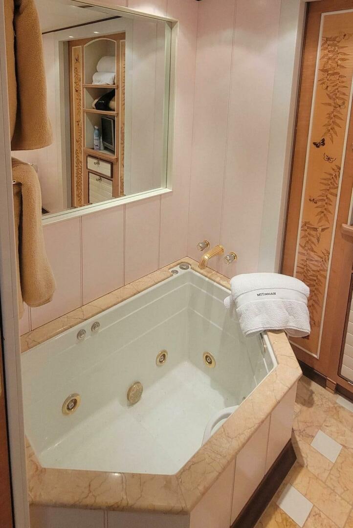 a bathroom with a large bathtub aboard MITSEAAH Yacht for Sale