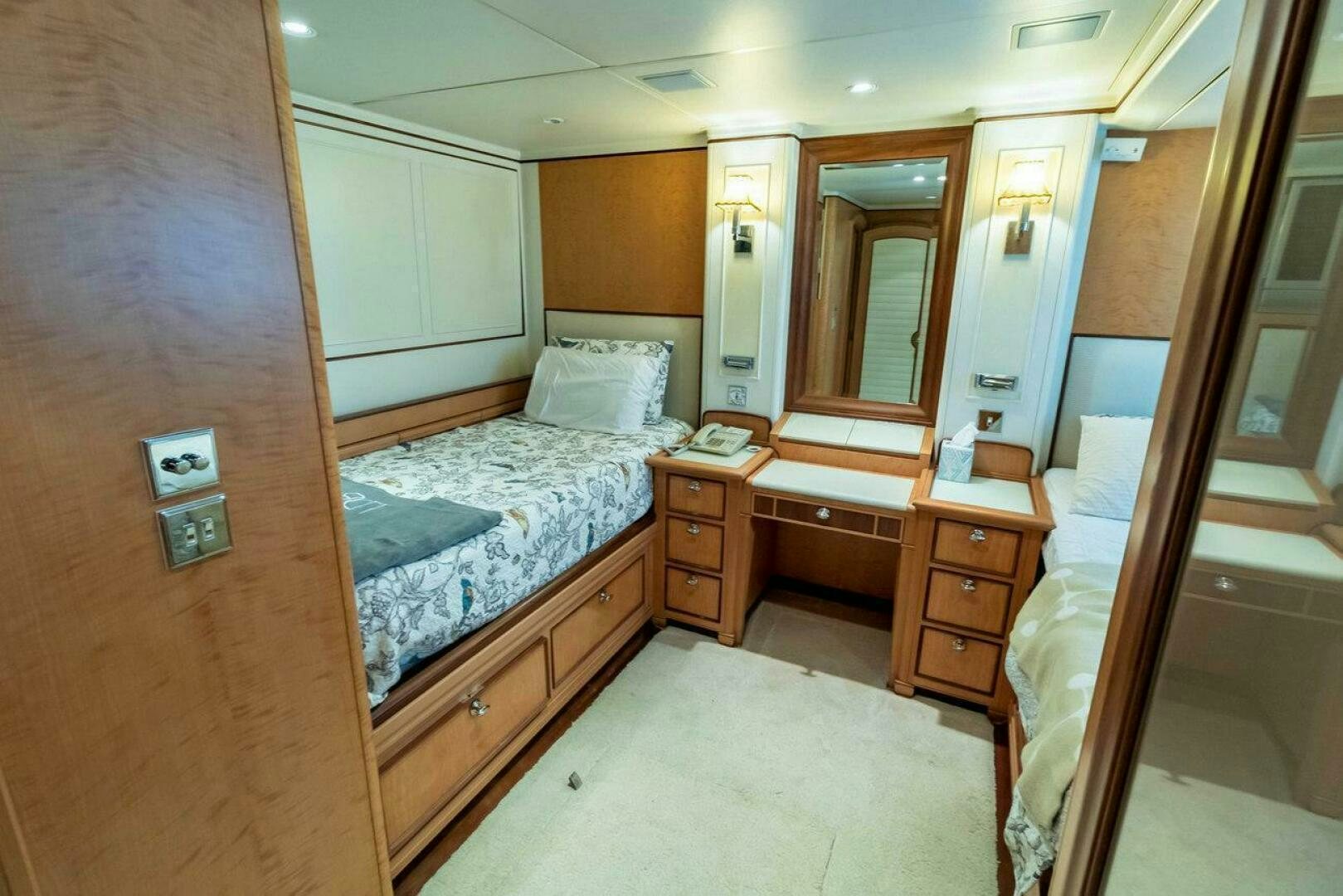 a bedroom with a bed and a desk aboard MITSEAAH Yacht for Sale