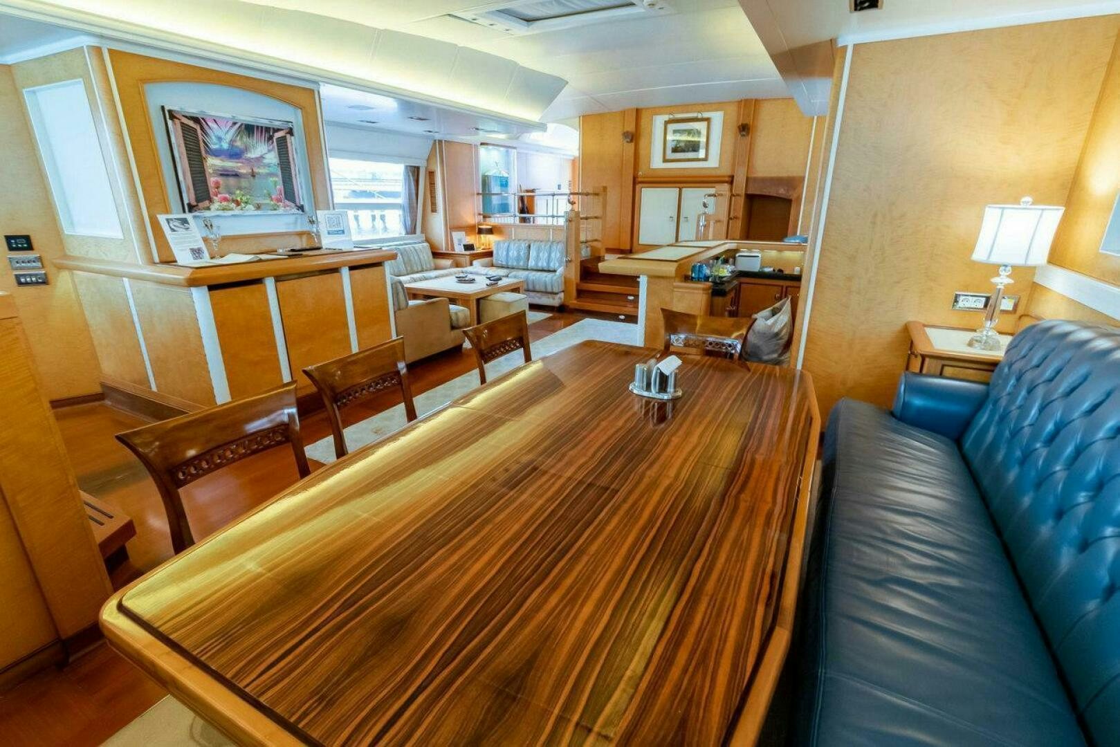 a living room with a couch and a coffee table aboard MITSEAAH Yacht for Sale
