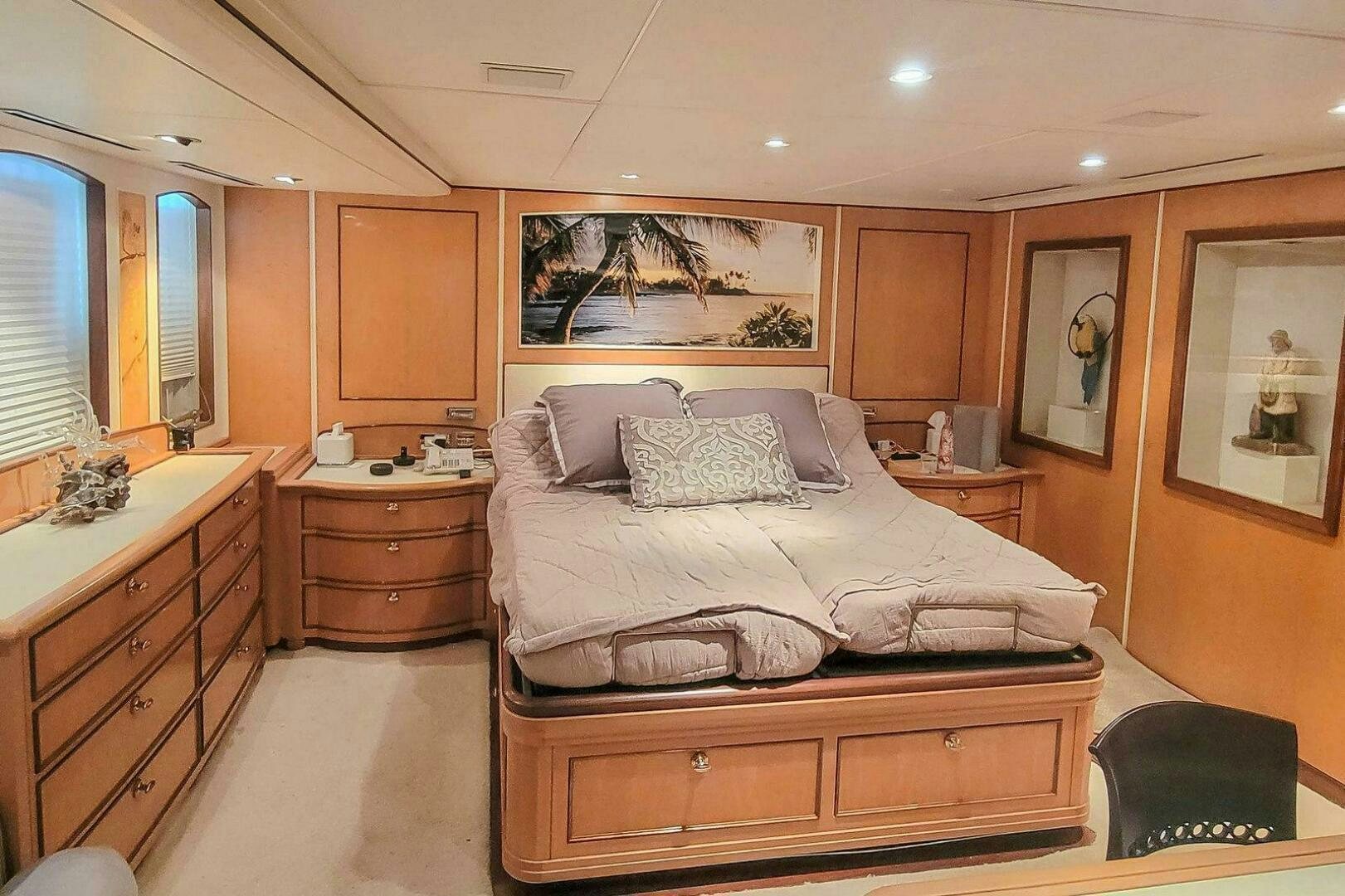 a bedroom with a bed and a desk aboard MITSEAAH Yacht for Sale