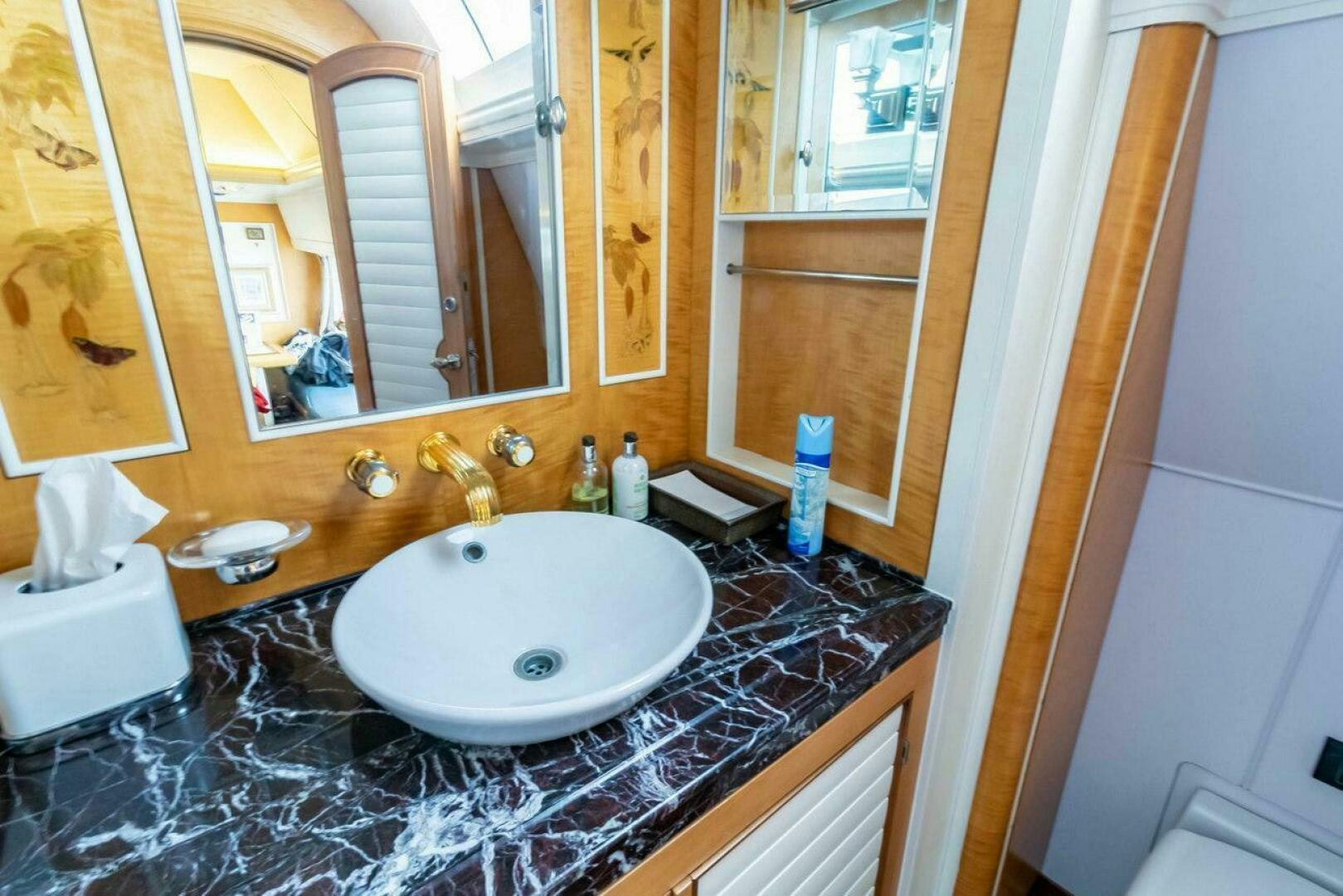 a bathroom with a sink and mirror aboard MITSEAAH Yacht for Sale