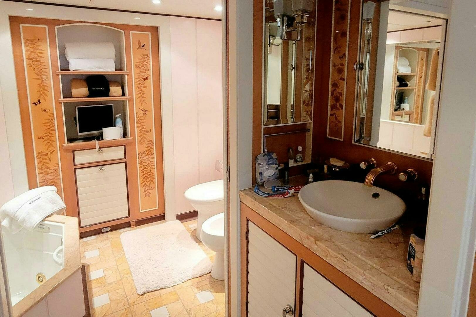 a bathroom with a sink and a toilet aboard MITSEAAH Yacht for Sale