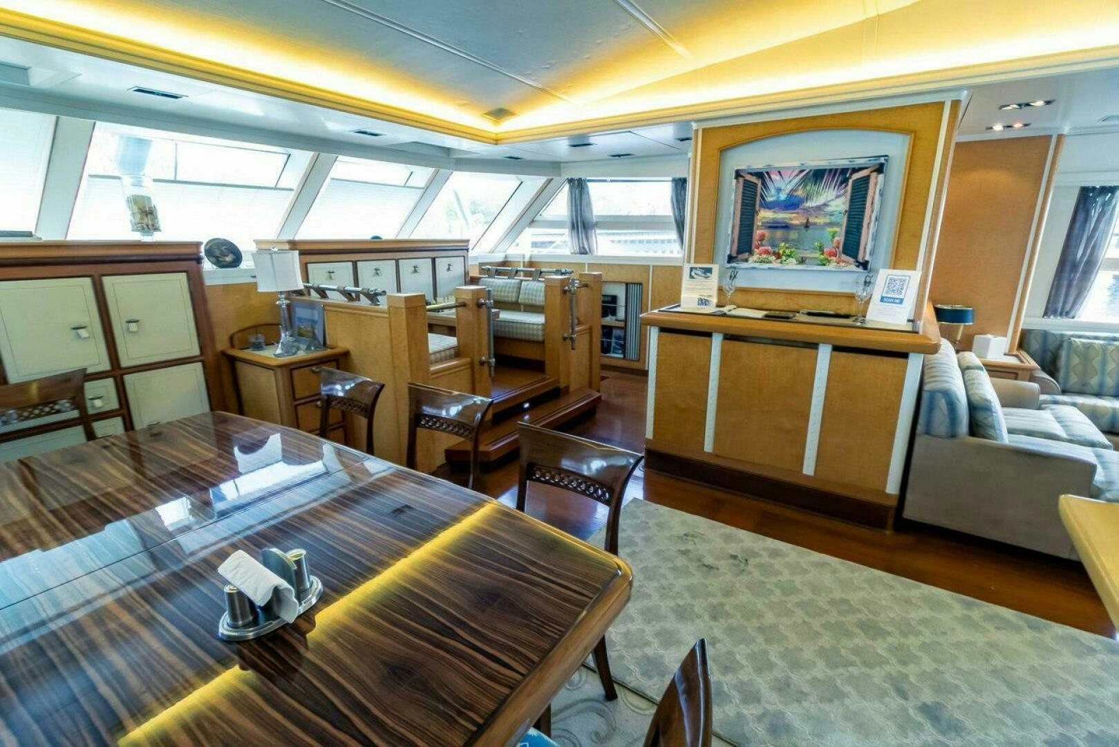 a room with a table and chairs aboard MITSEAAH Yacht for Sale