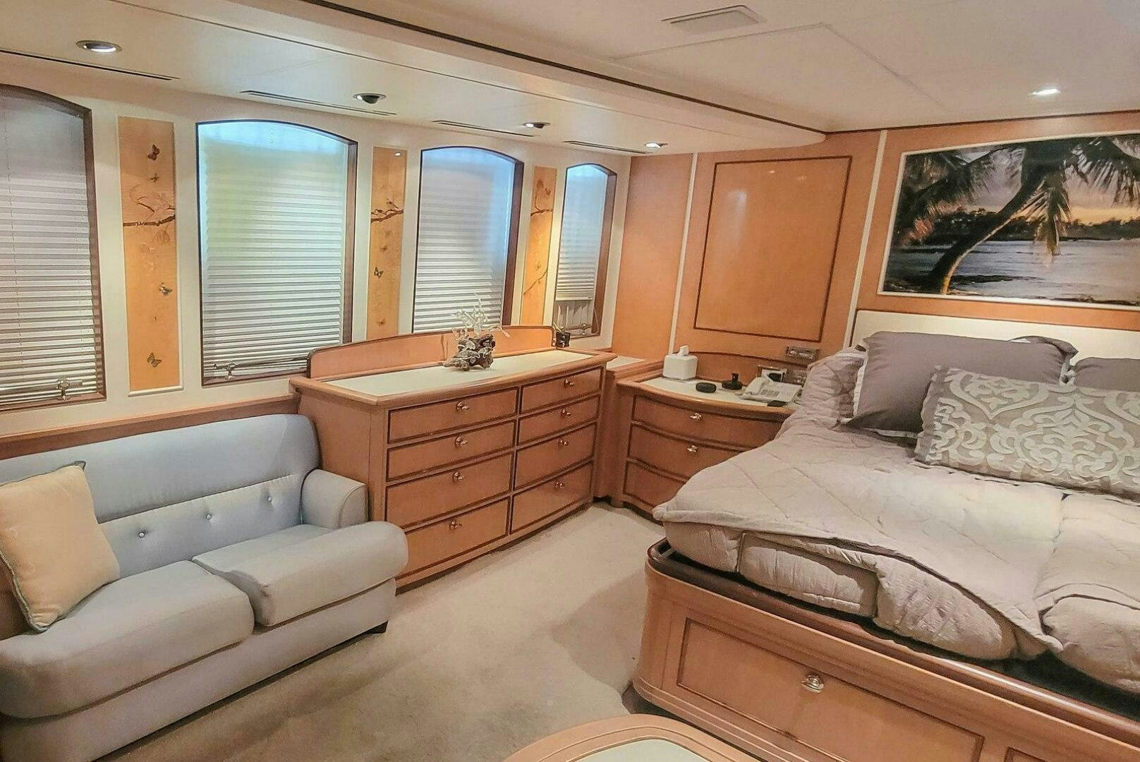 a bedroom with a bed and a dresser aboard MITSEAAH Yacht for Sale