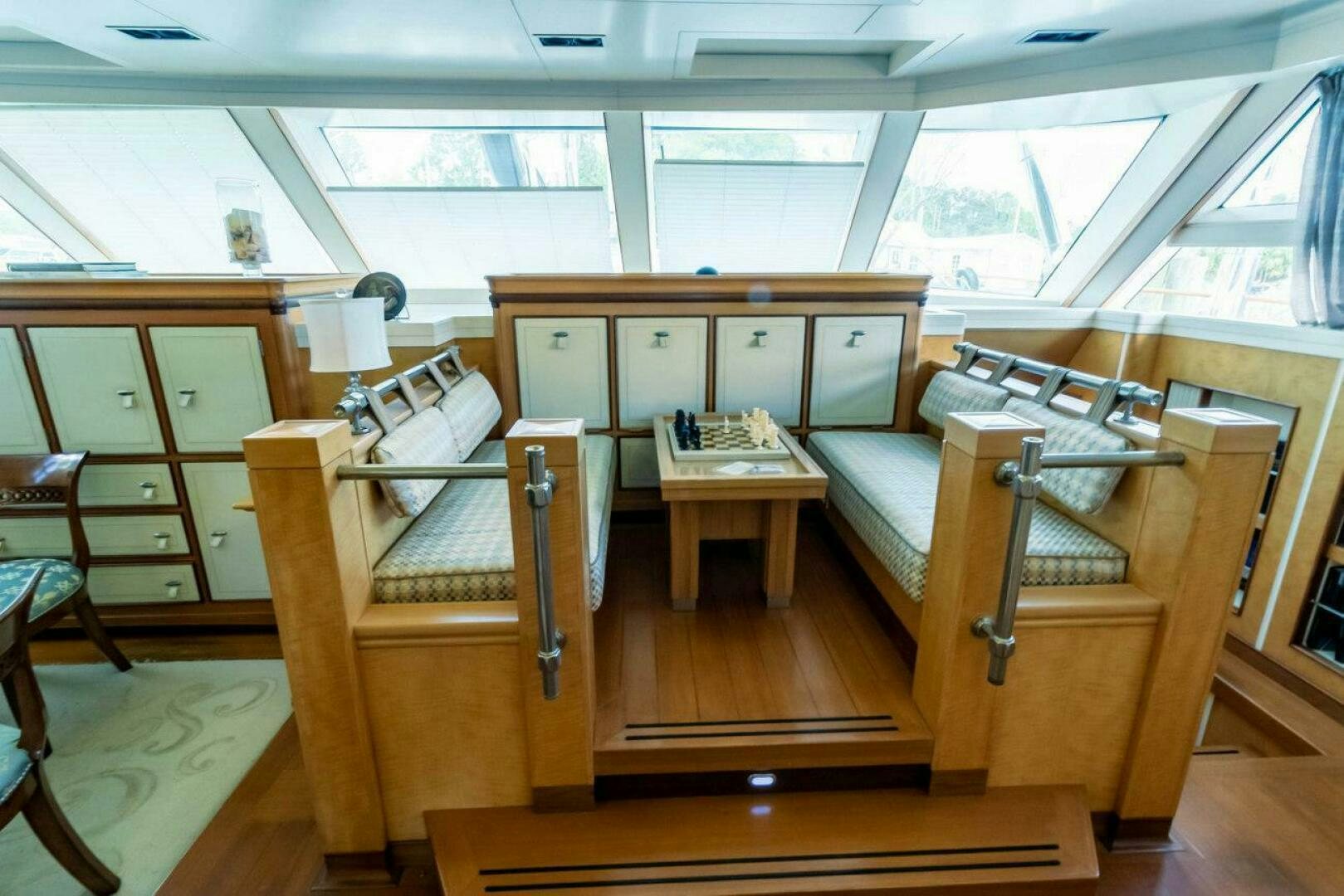 a room with wooden furniture aboard MITSEAAH Yacht for Sale