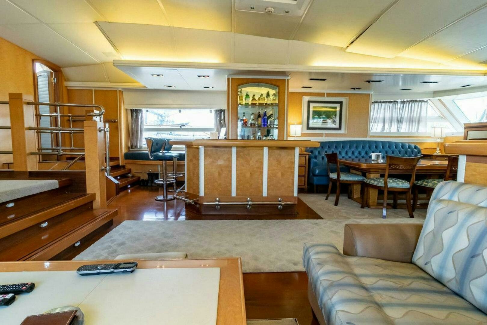 a room with a couch and a table and chairs aboard MITSEAAH Yacht for Sale