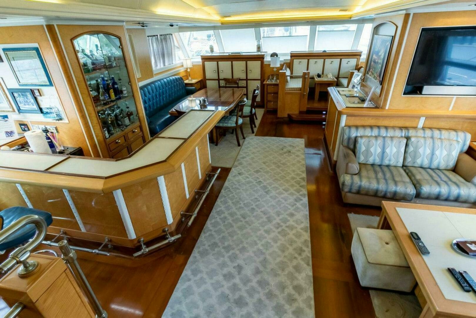 a large room with a couch and a table aboard MITSEAAH Yacht for Sale