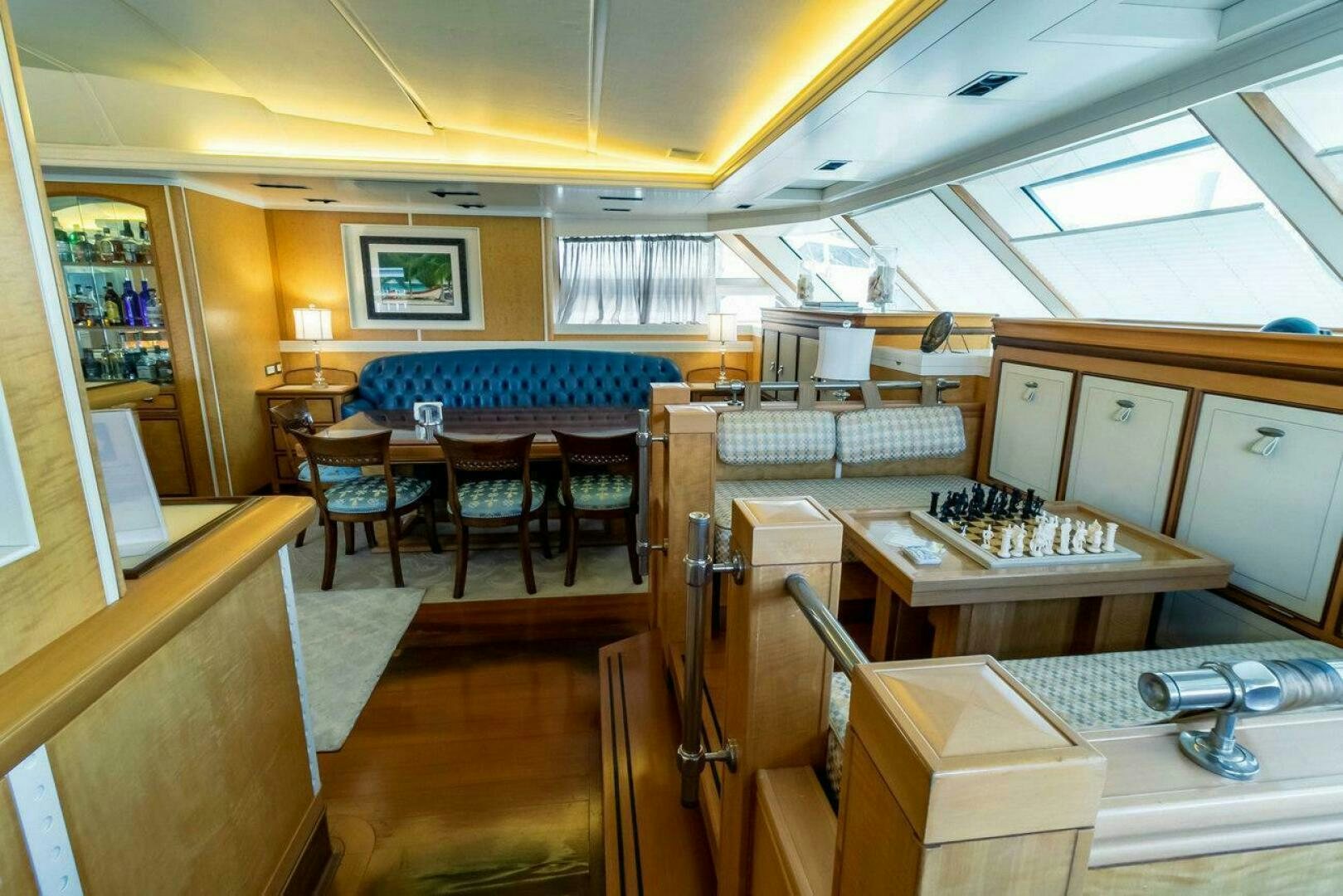 a room with a table and chairs aboard MITSEAAH Yacht for Sale