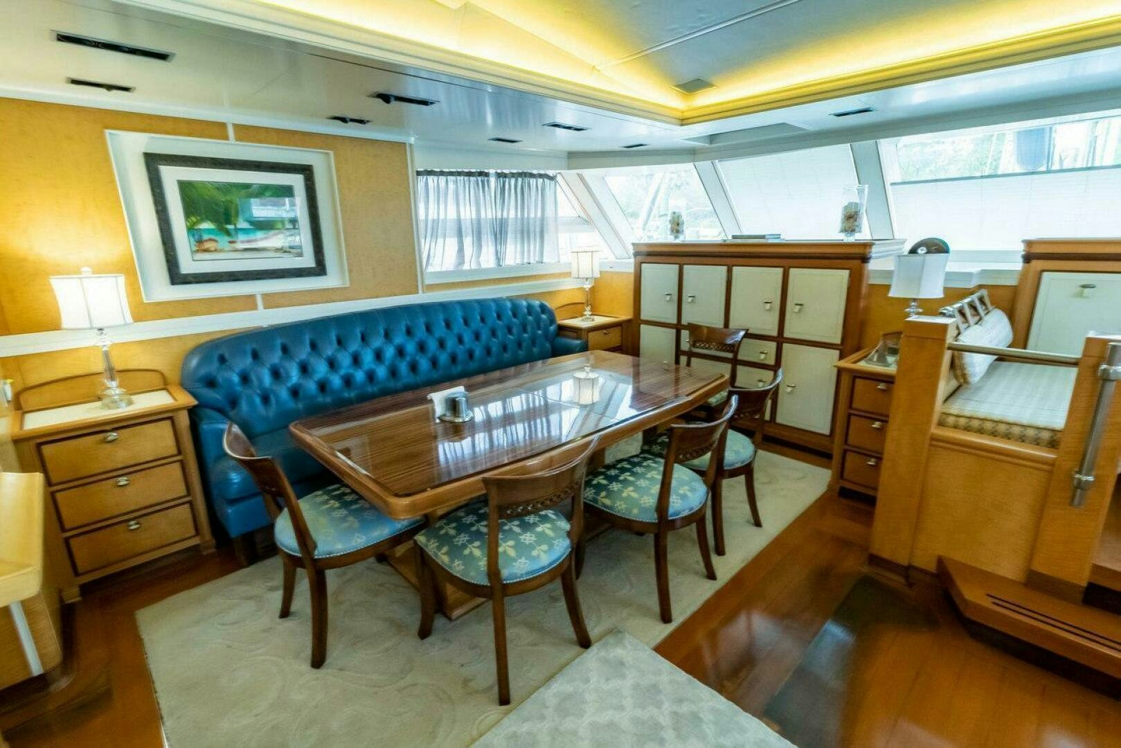 a bedroom with a bed and a table aboard MITSEAAH Yacht for Sale
