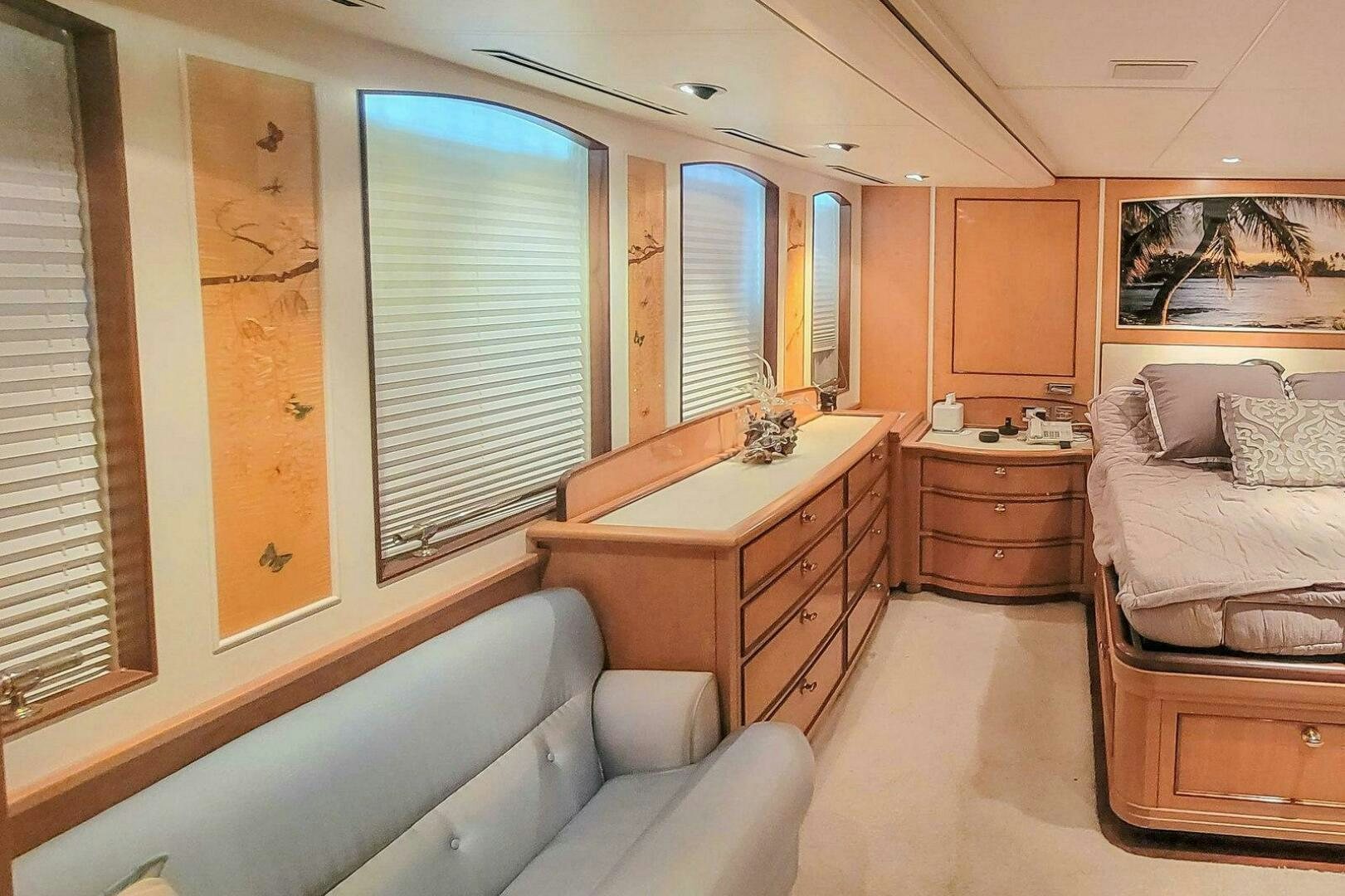 a bedroom with a bed and a desk aboard MITSEAAH Yacht for Sale