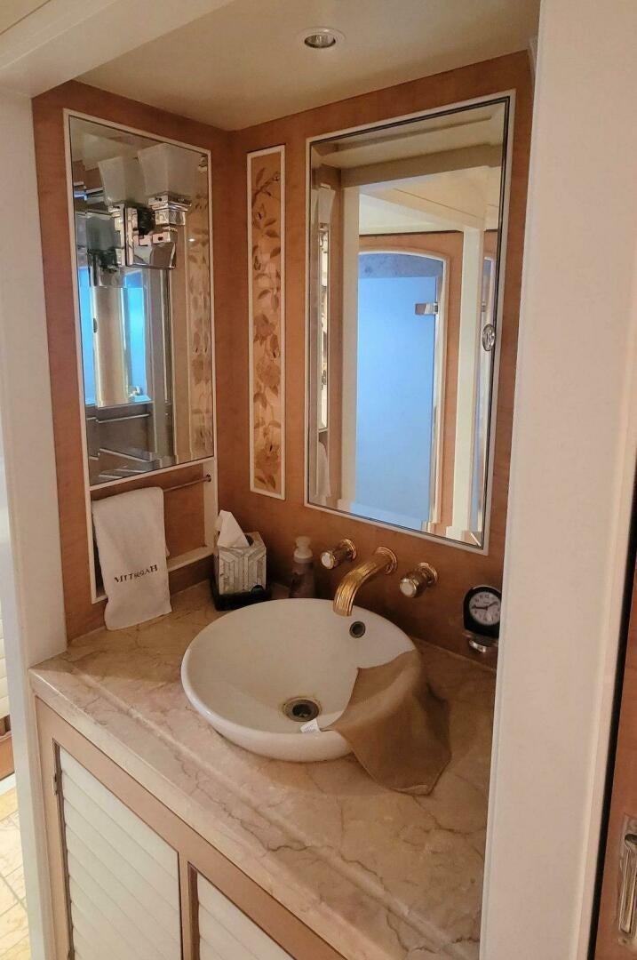 a bathroom with a large mirror aboard MITSEAAH Yacht for Sale