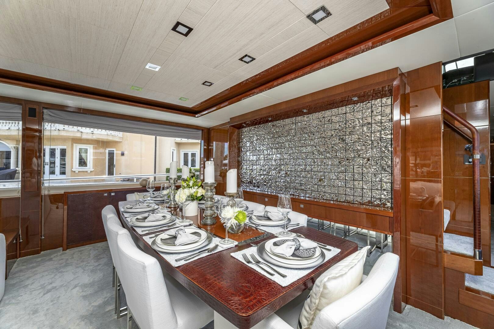 a dining room with a table and chairs aboard BEACHFRONT II Yacht for Sale