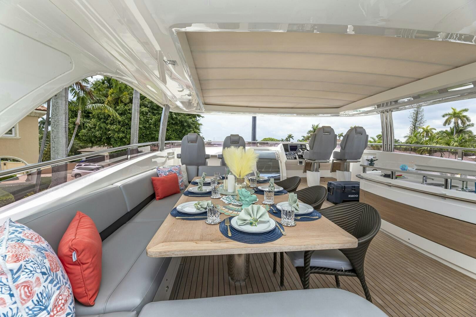 a table with chairs and a couch aboard BEACHFRONT II Yacht for Sale