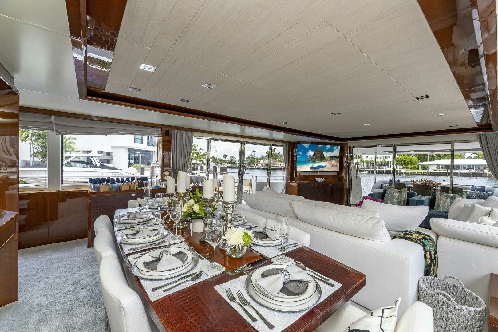 a dining table in a living room aboard BEACHFRONT II Yacht for Sale