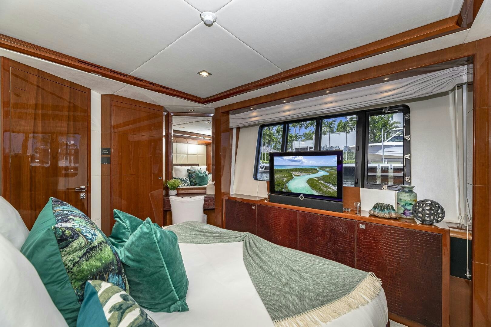 a living room with a large television aboard BEACHFRONT II Yacht for Sale