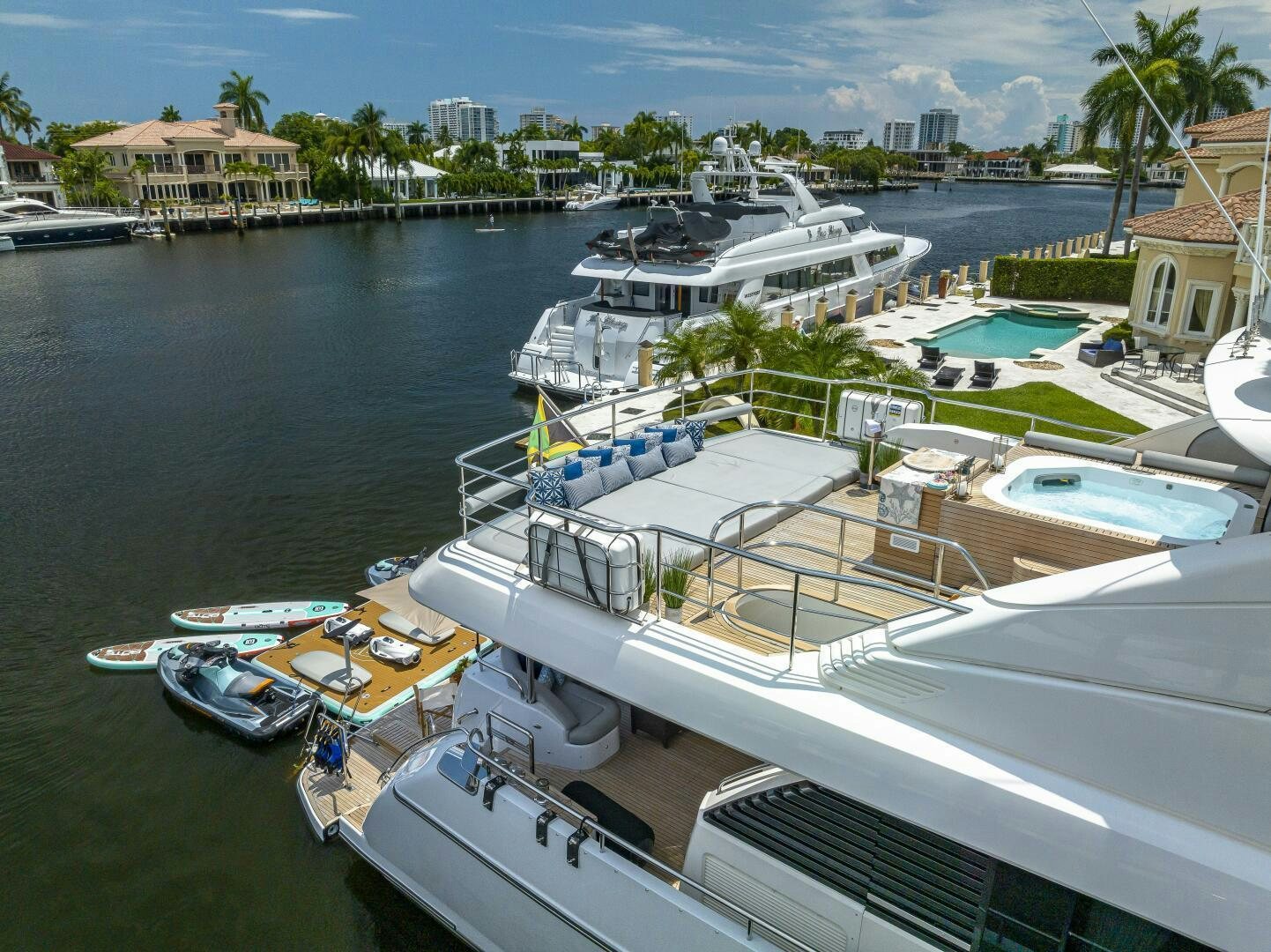 a marina with boats and buildings aboard BEACHFRONT II Yacht for Sale