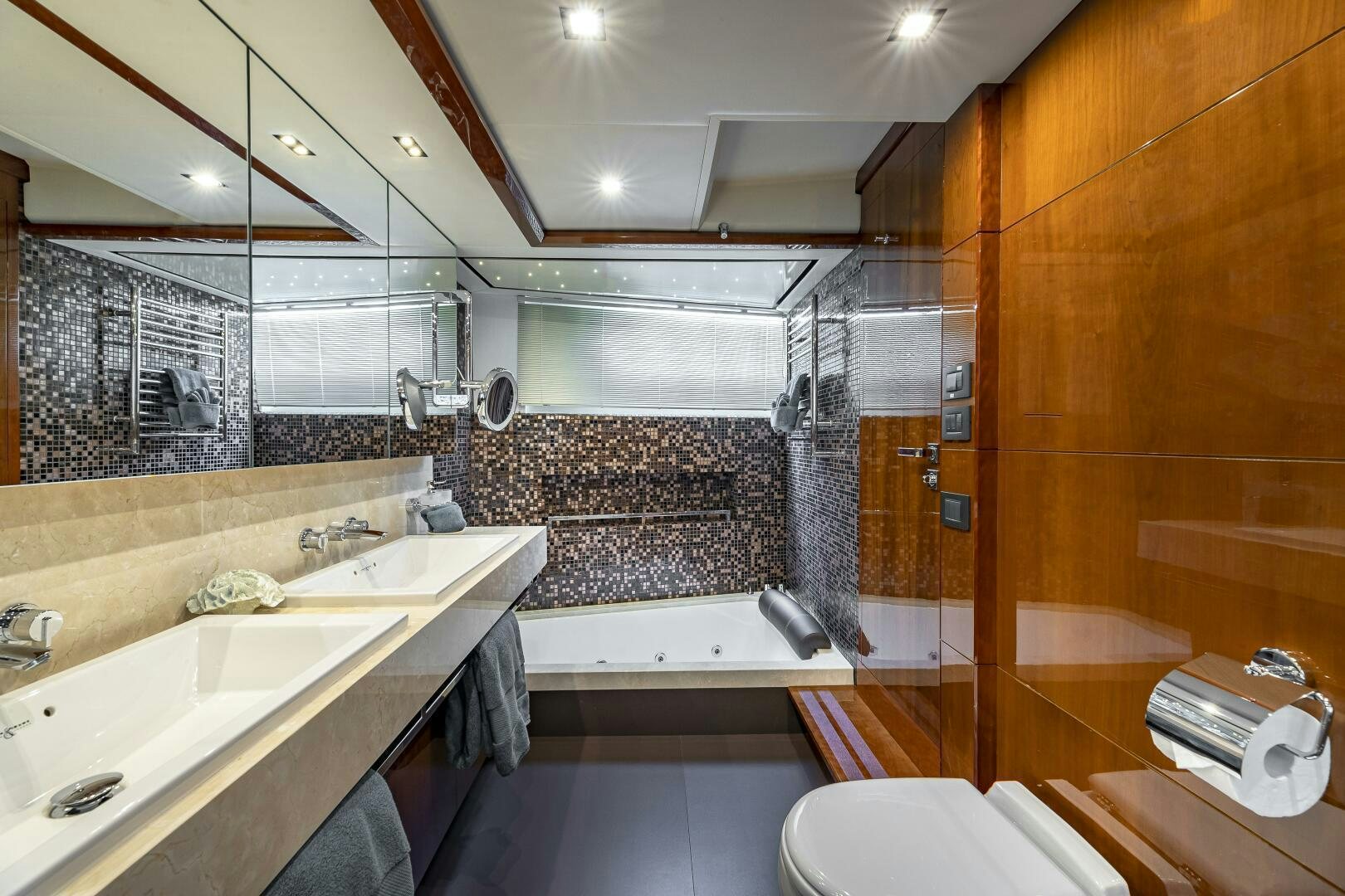 a bathroom with a large mirror aboard BEACHFRONT II Yacht for Sale